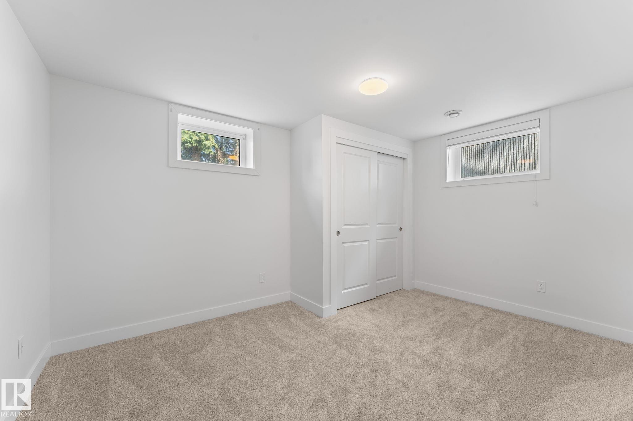 Plush carpeting, and a window for natural illumination - 6108 102 Avenue Nw, Edmonton, AB