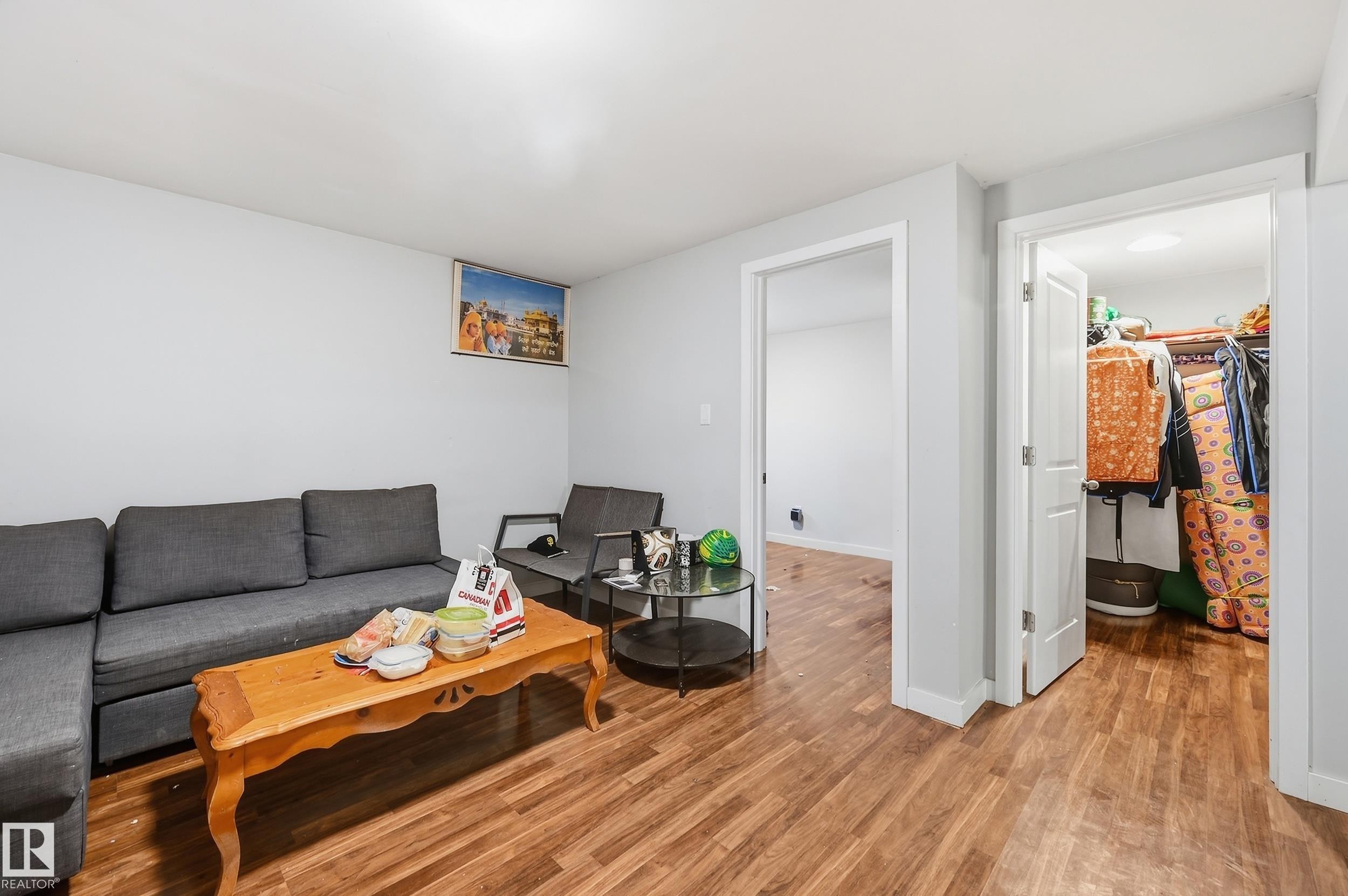 Wood-finish flooring throughout, white walls, and white trim - 941 Ebbers Crescent Nw, Edmonton, AB