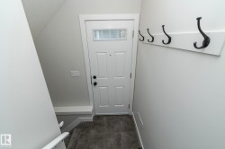 White paneled door with transom window - 
