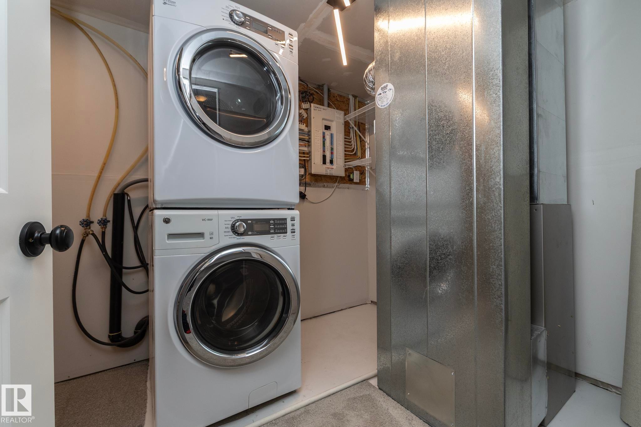 Stackable laundry appliances with a front-loading washer and dryer - 53/55 Michigan Street, Devon, AB