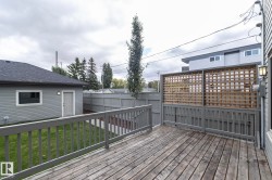 Expansive outdoor deck with gray railing - 