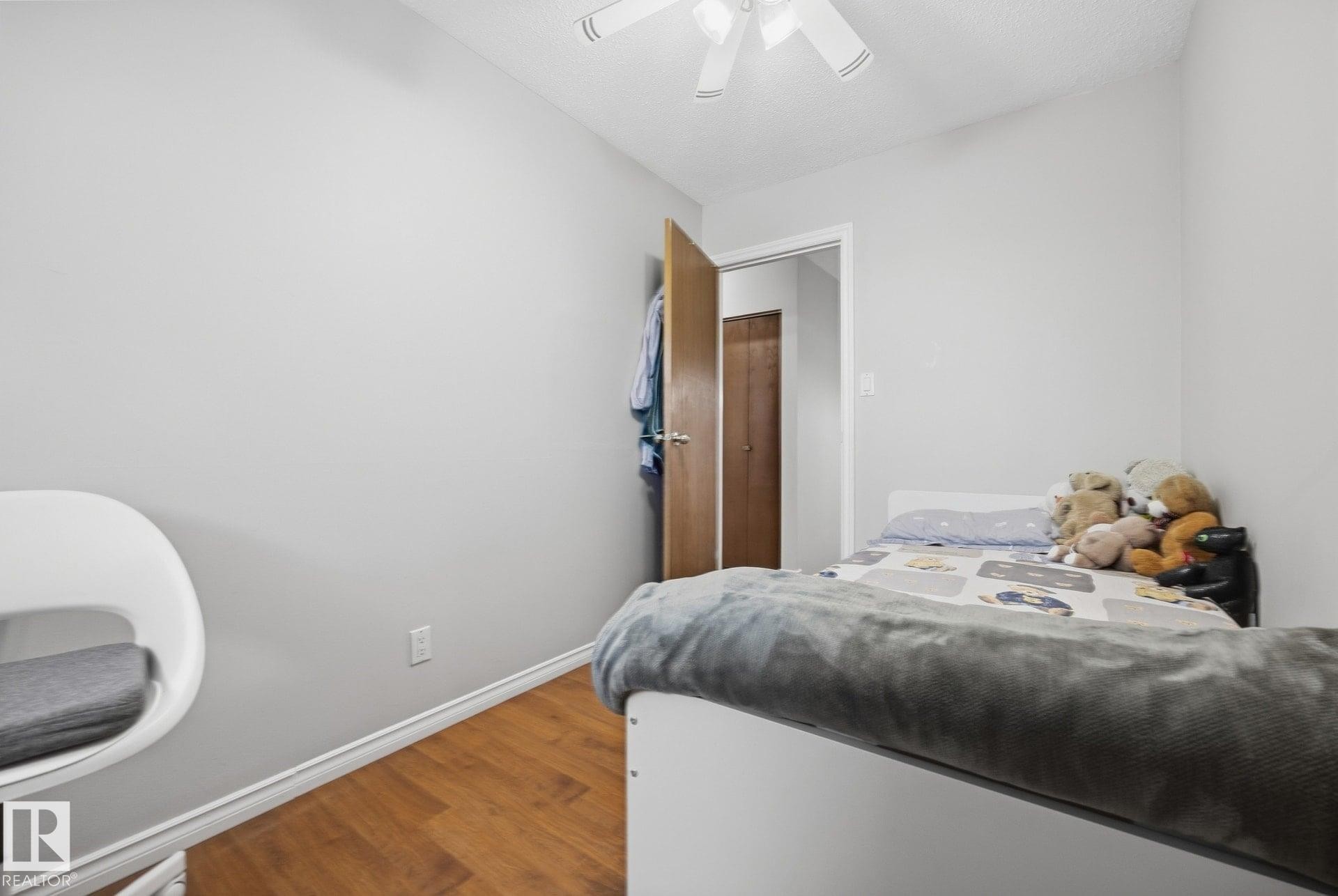 Hardwood-finish flooring, light grey wall paint, and a ceiling fan - #2 14120 80 St Nw, Edmonton, AB