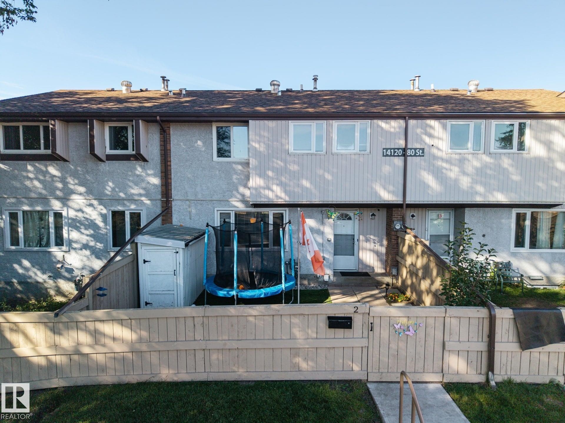 Stucco and siding exterior with a shingle roof - #2 14120 80 St Nw, Edmonton, AB