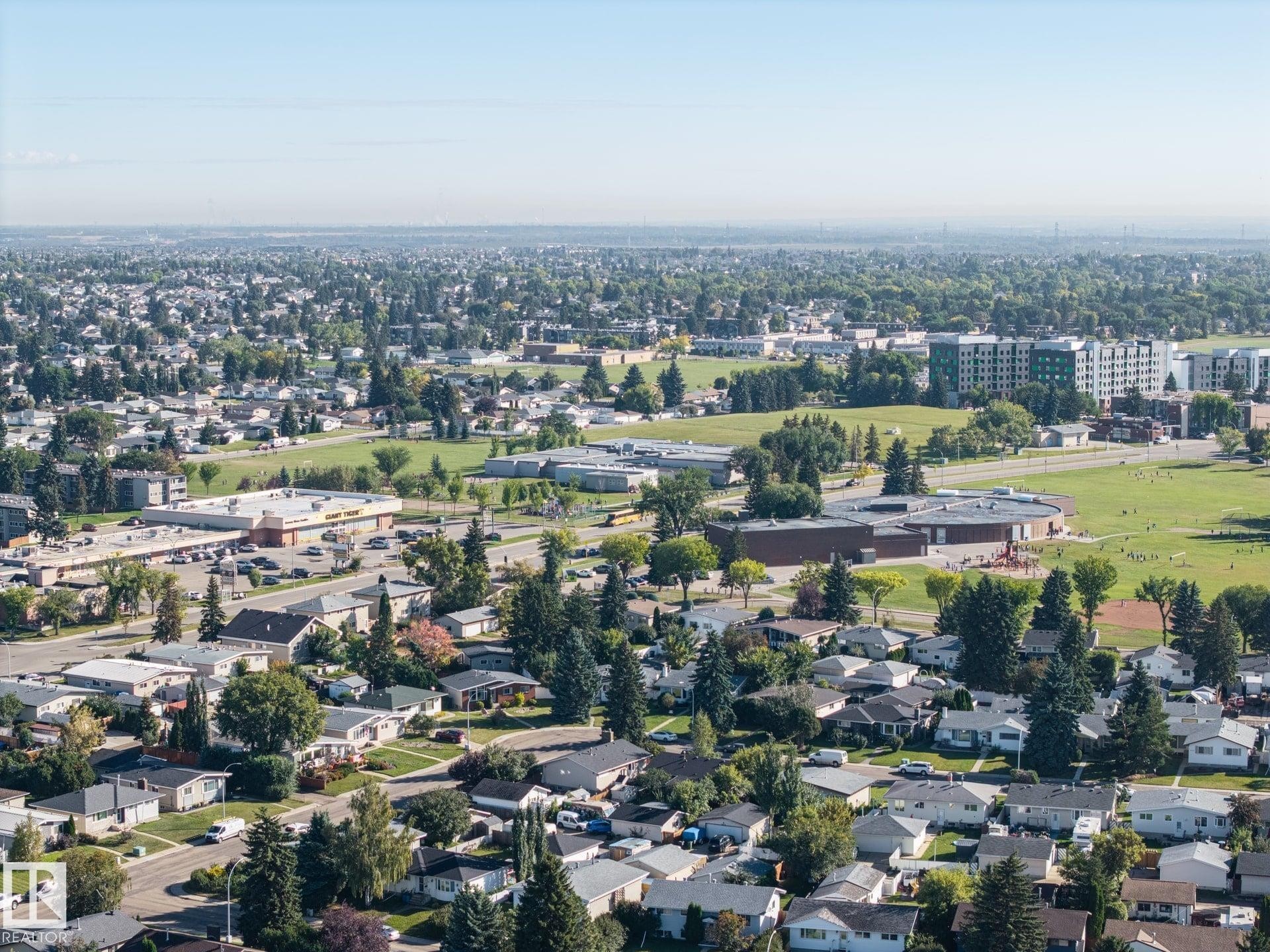 Expansive suburban landscape with varied residential architecture, established tree canopy, and recreational green spaces - #2 14120 80 St Nw, Edmonton, AB