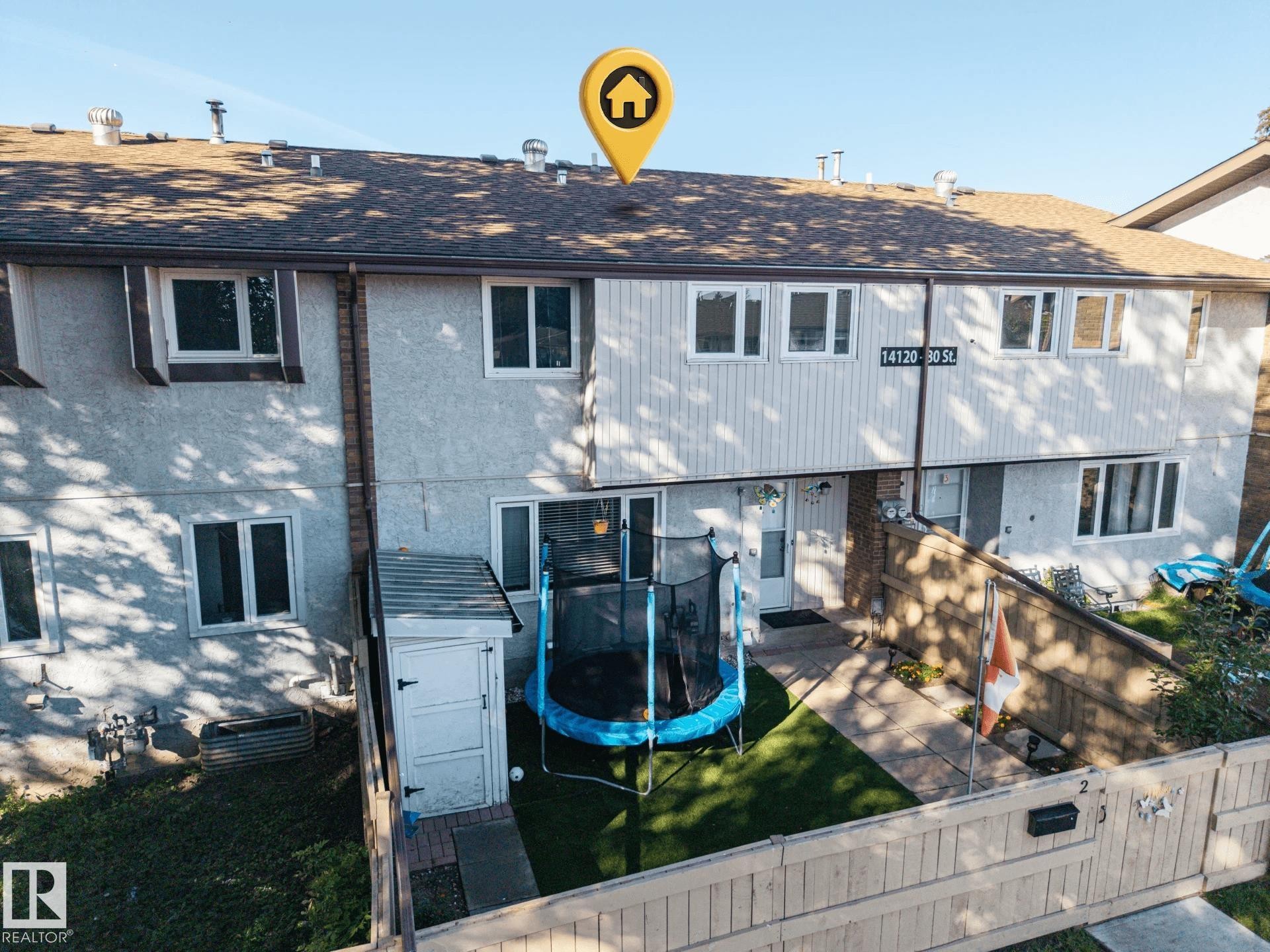 Multi-level residential exterior with white window frames and a shingled roof - #2 14120 80 St Nw, Edmonton, AB
