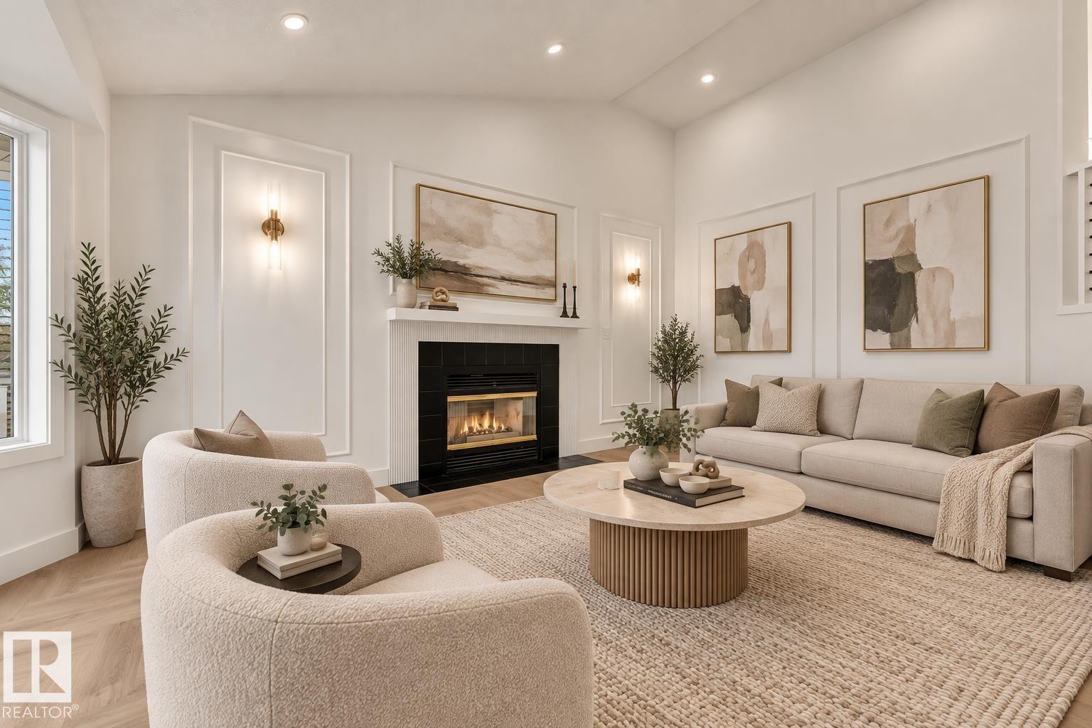 Vaulted ceiling with recessed lighting, wood-finish flooring, fireplace with black tile surround, decorative wall molding, and wall sconces - 3320 43 Street Nw, Edmonton, AB