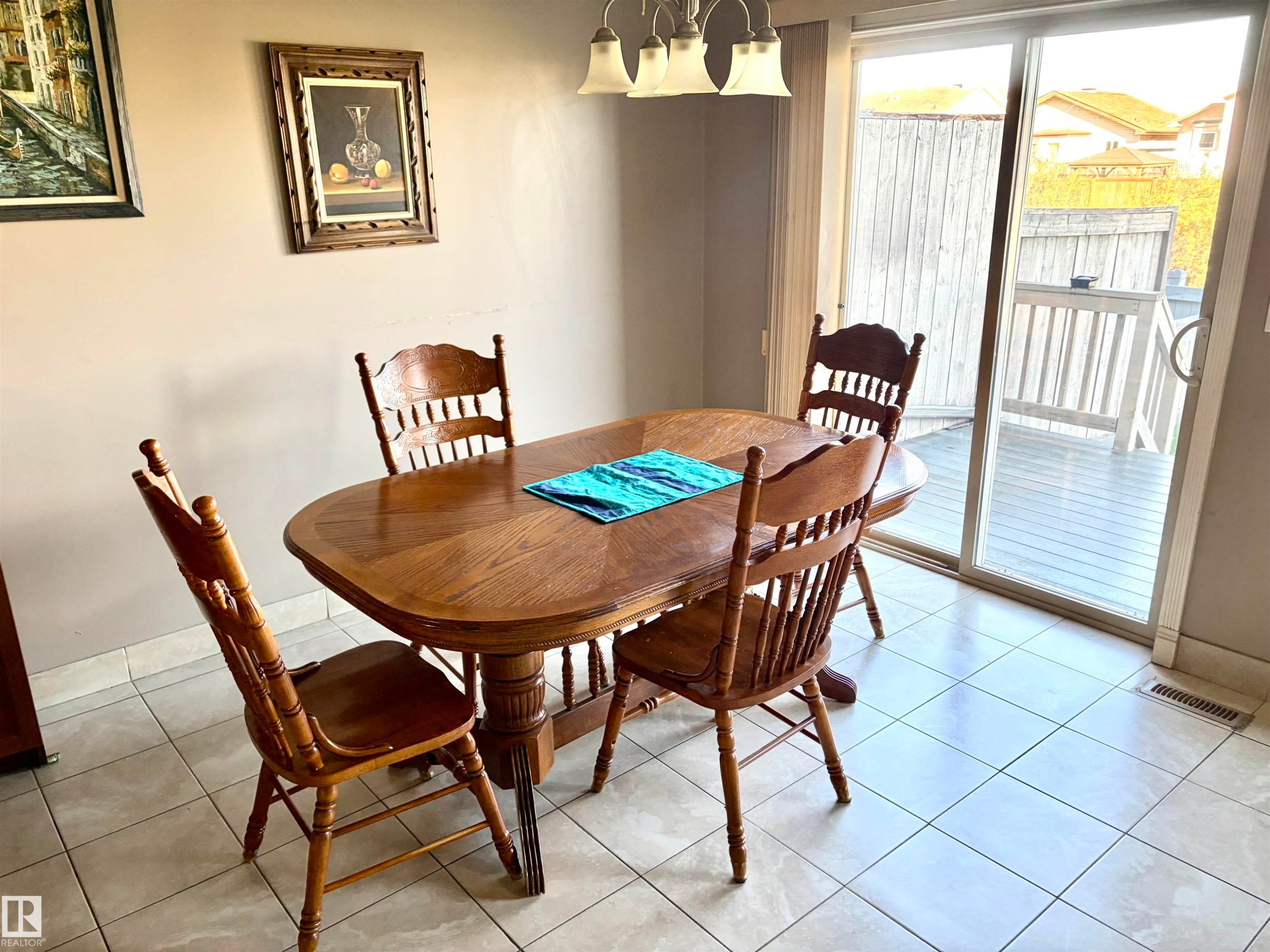 Sliding glass door, outdoor decking, and ceramic tile flooring - #17 16317 64 St Nw, Edmonton, AB