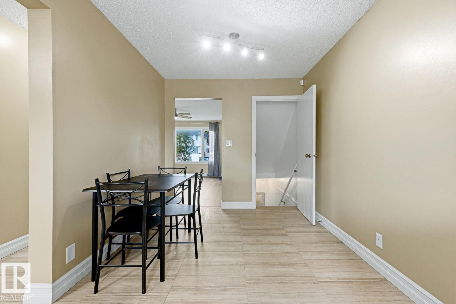 Light-toned tile flooring, neutral wall paint, and recessed ceiling lighting - 11317 22 Avenue Nw, Edmonton, AB