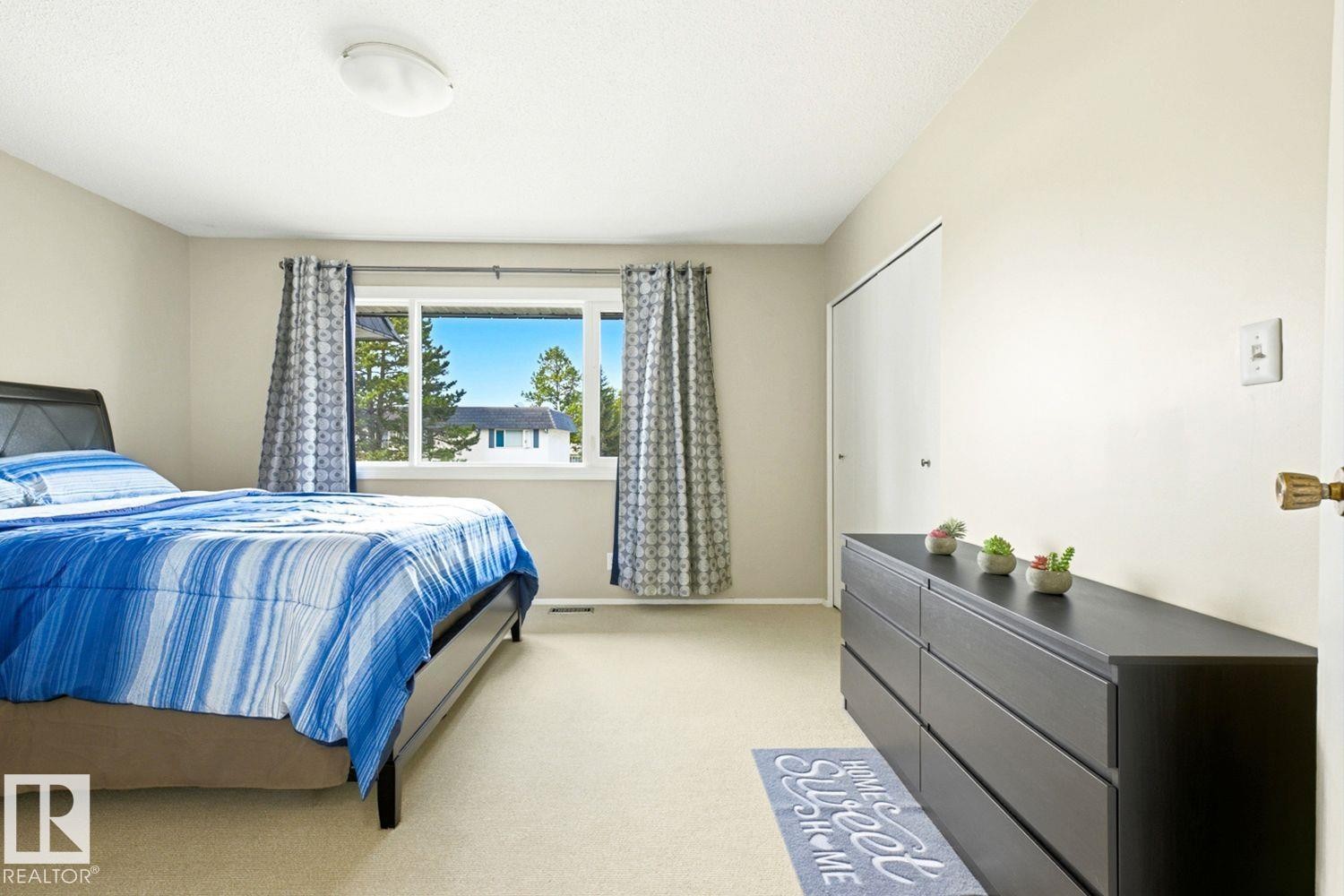 Wall-to-wall carpeting with neutral tone walls - 11317 22 Avenue Nw, Edmonton, AB