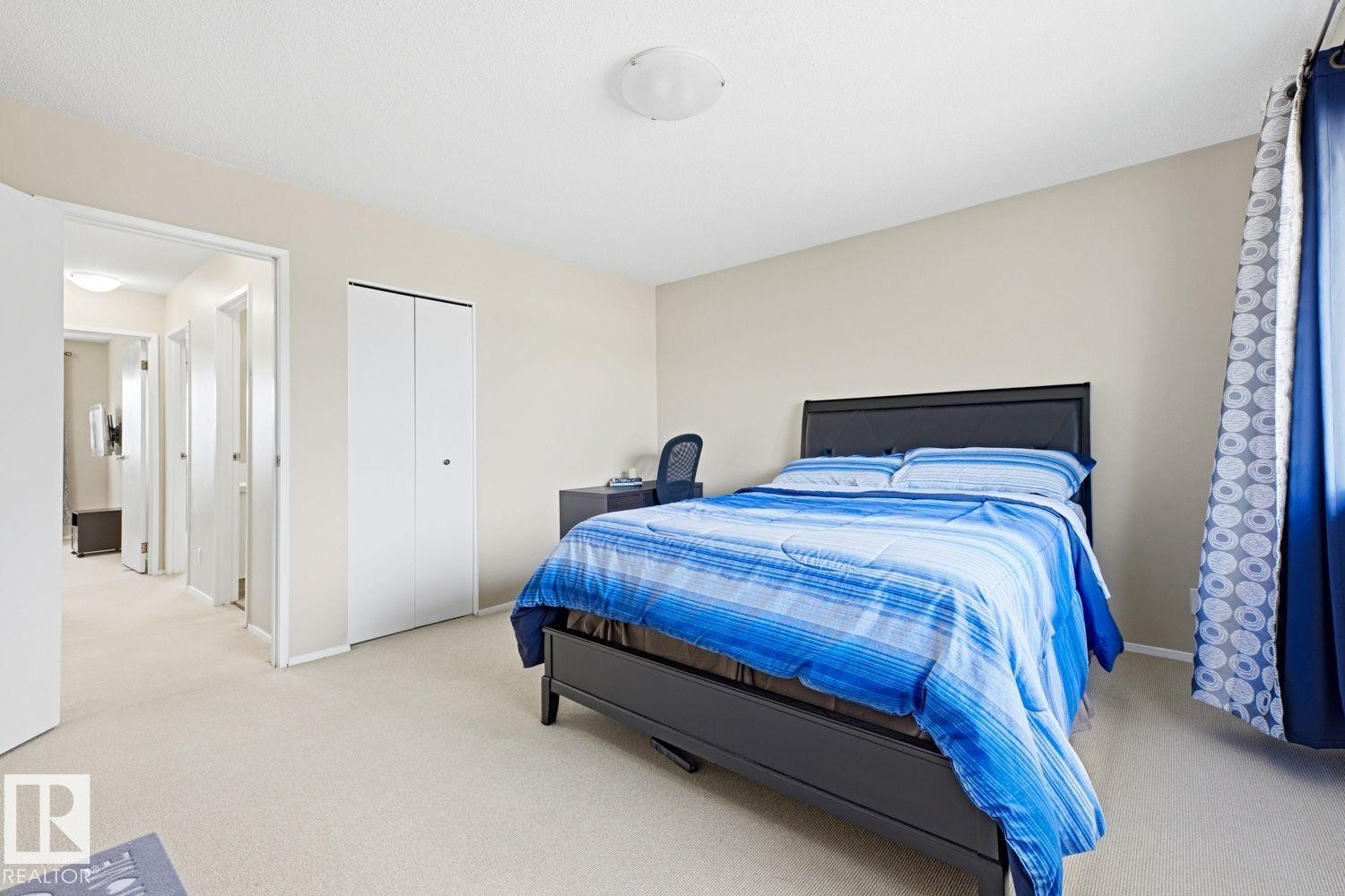 Wall-to-wall carpeting and neutral wall tones - 11317 22 Avenue Nw, Edmonton, AB