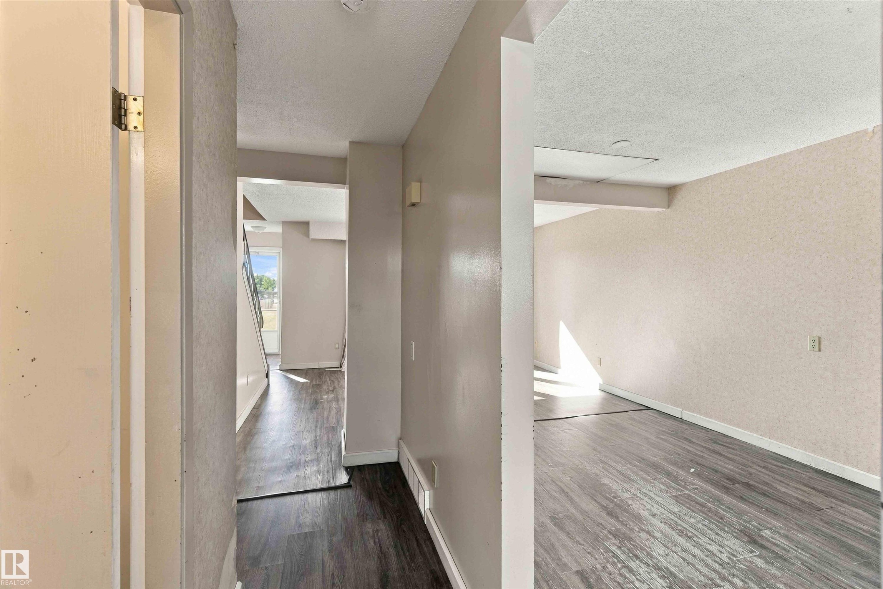 Wood-finish flooring throughout, with light-toned walls - 17351 85 Avenue Nw, Edmonton, AB