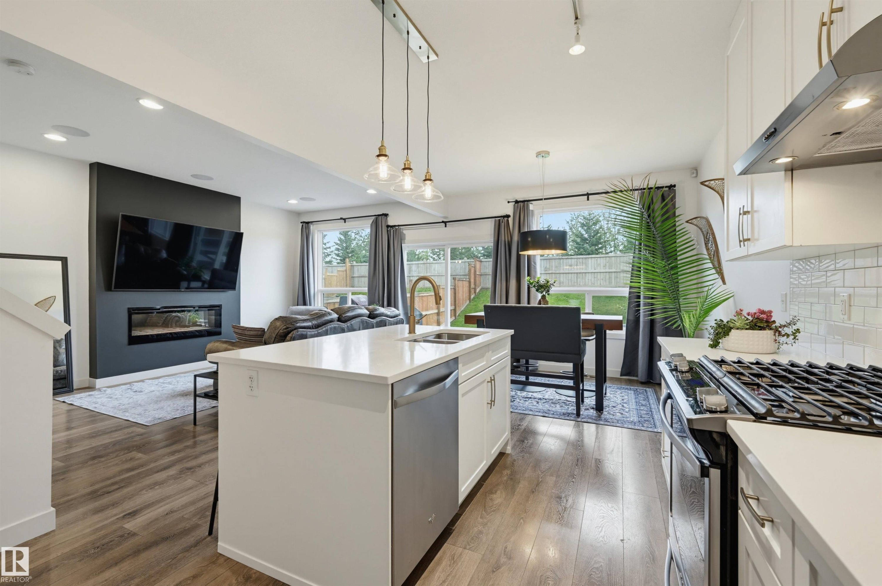 22434 99A Avenue Nw, Edmonton, AB - Indoor Photo Showing Kitchen With Fireplace