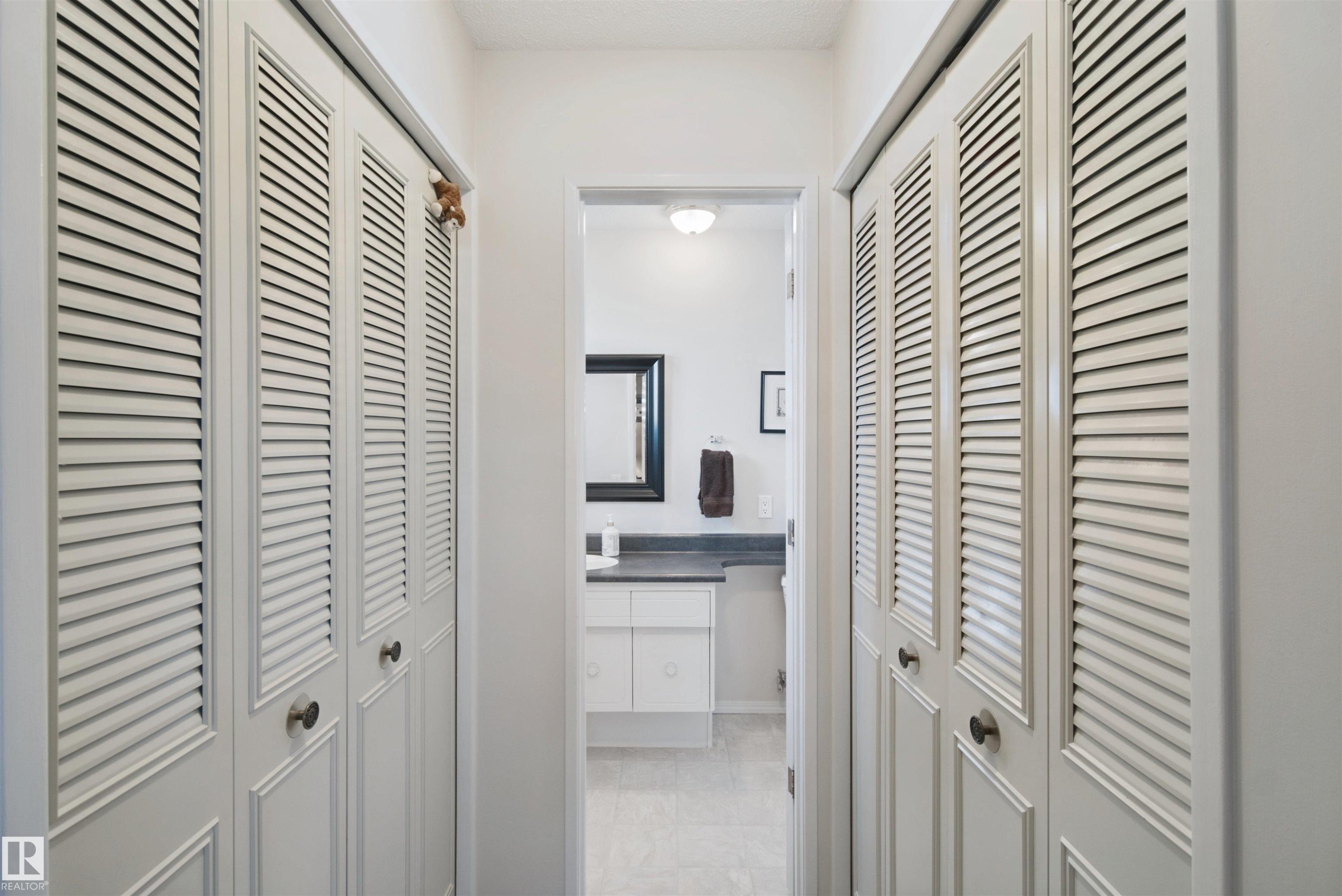 Double closets leading to the 2 pc ensuite bathroom - 11439 144 Avenue Nw, Edmonton, AB