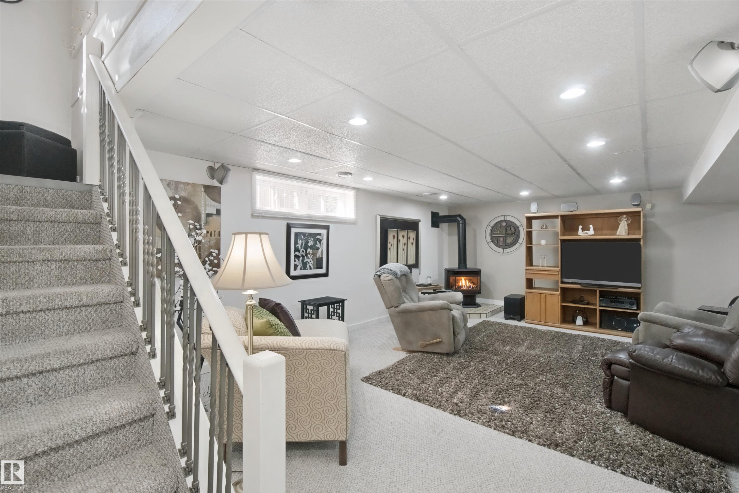 Recessed lighting and gas stove with a tile hearth - 11439 144 Avenue Nw, Edmonton, AB