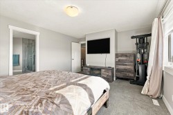 Carpeted room with light gray walls, a flush-mount ceiling light, and white trim - 