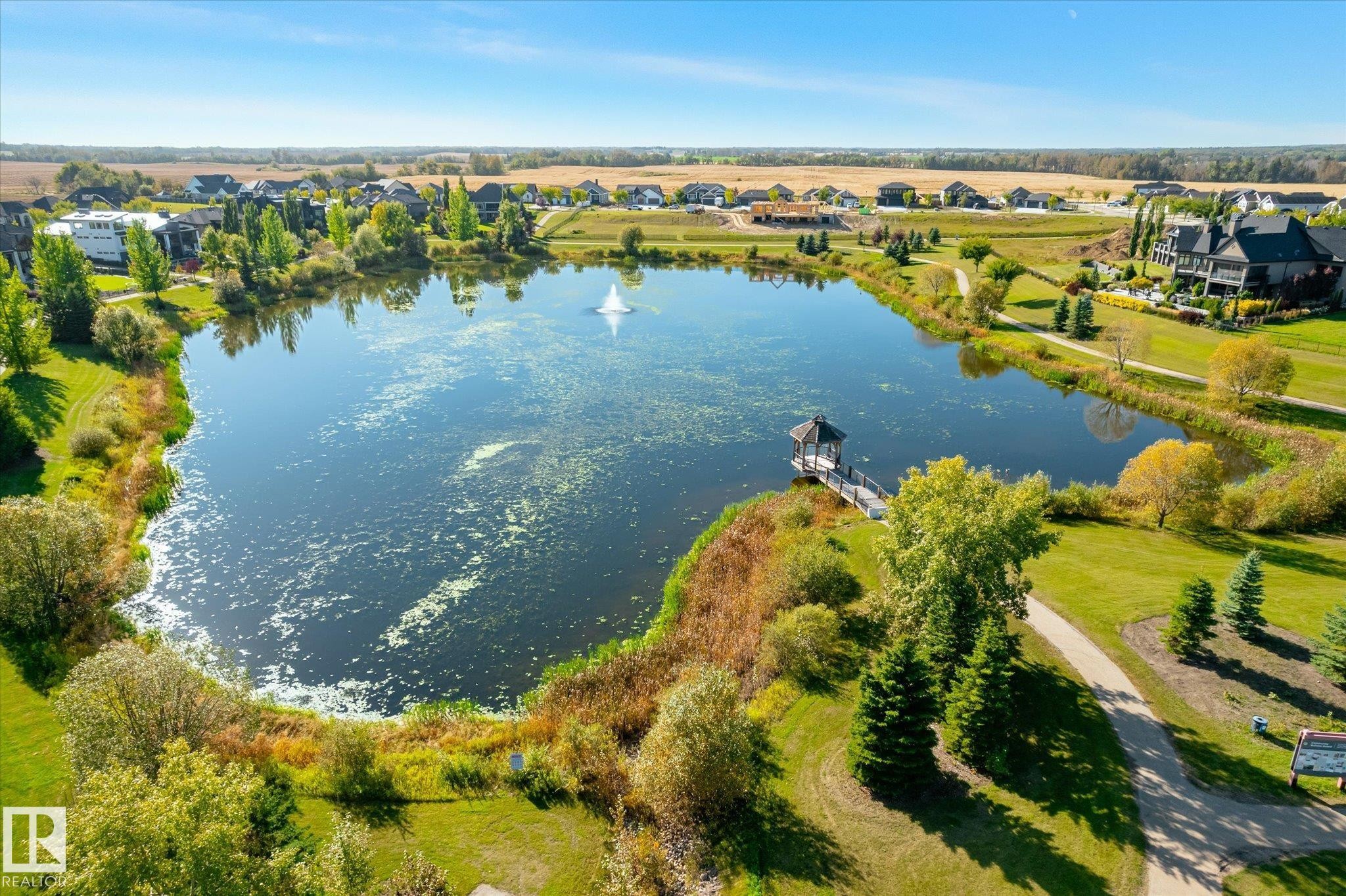Expansive body of water with a central fountain - 2011 Genesis Lane, Stony Plain, AB