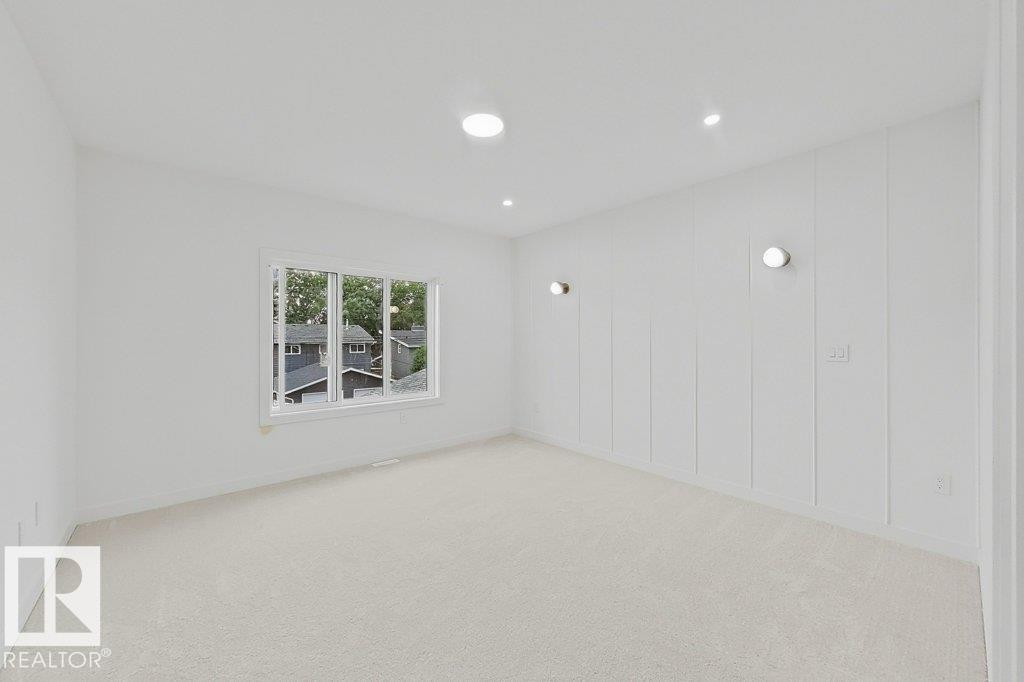 Spacious room with plush light-colored carpet and recessed ceiling lighting - 9216 91 Street Nw, Edmonton, AB - Indoor Photo Showing Bathroom