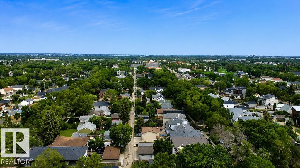 Expansive aerial perspective showcasing a residential area with mature tree coverage - 9216 91 Street Nw, Edmonton, AB - Indoor Photo Showing Bathroom