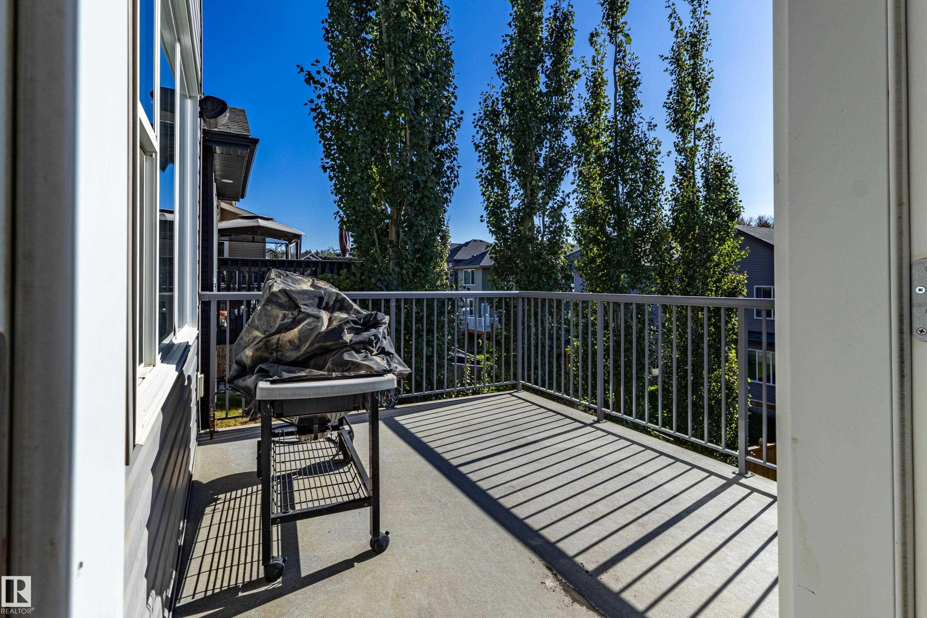 Private balcony with concrete flooring and metal railings - 233 Hawks Ridge Boulevard Nw, Edmonton, AB