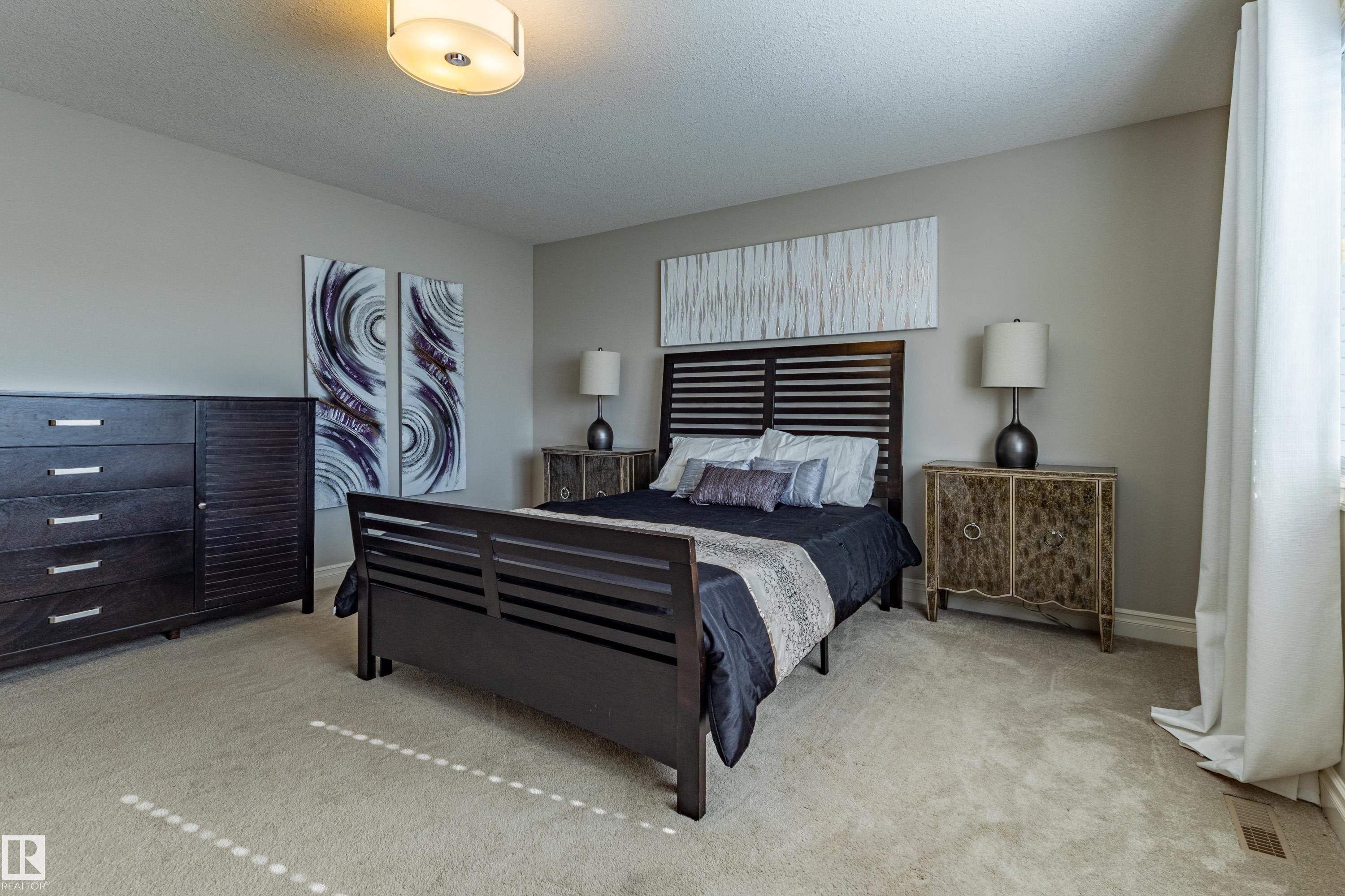 Plush carpet flooring, neutral wall tones, and a ceiling-mounted light fixture - 233 Hawks Ridge Boulevard Nw, Edmonton, AB