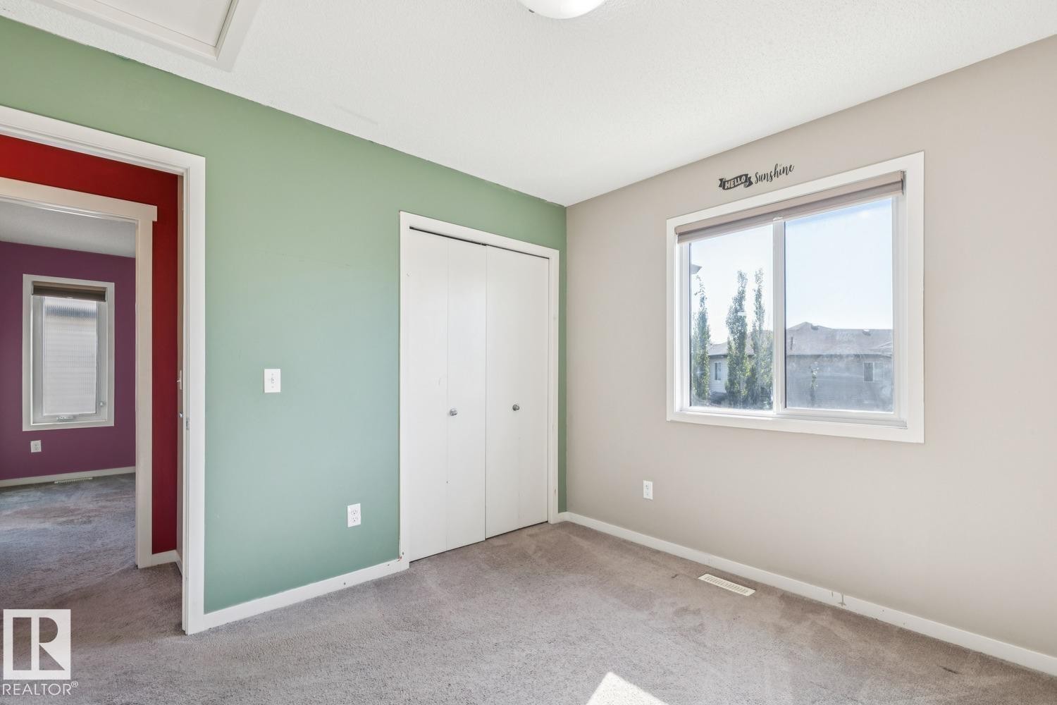 Wall-to-wall carpeting, dual-pane window, and bifold closet doors - 12007 173 Avenue Nw, Edmonton, AB