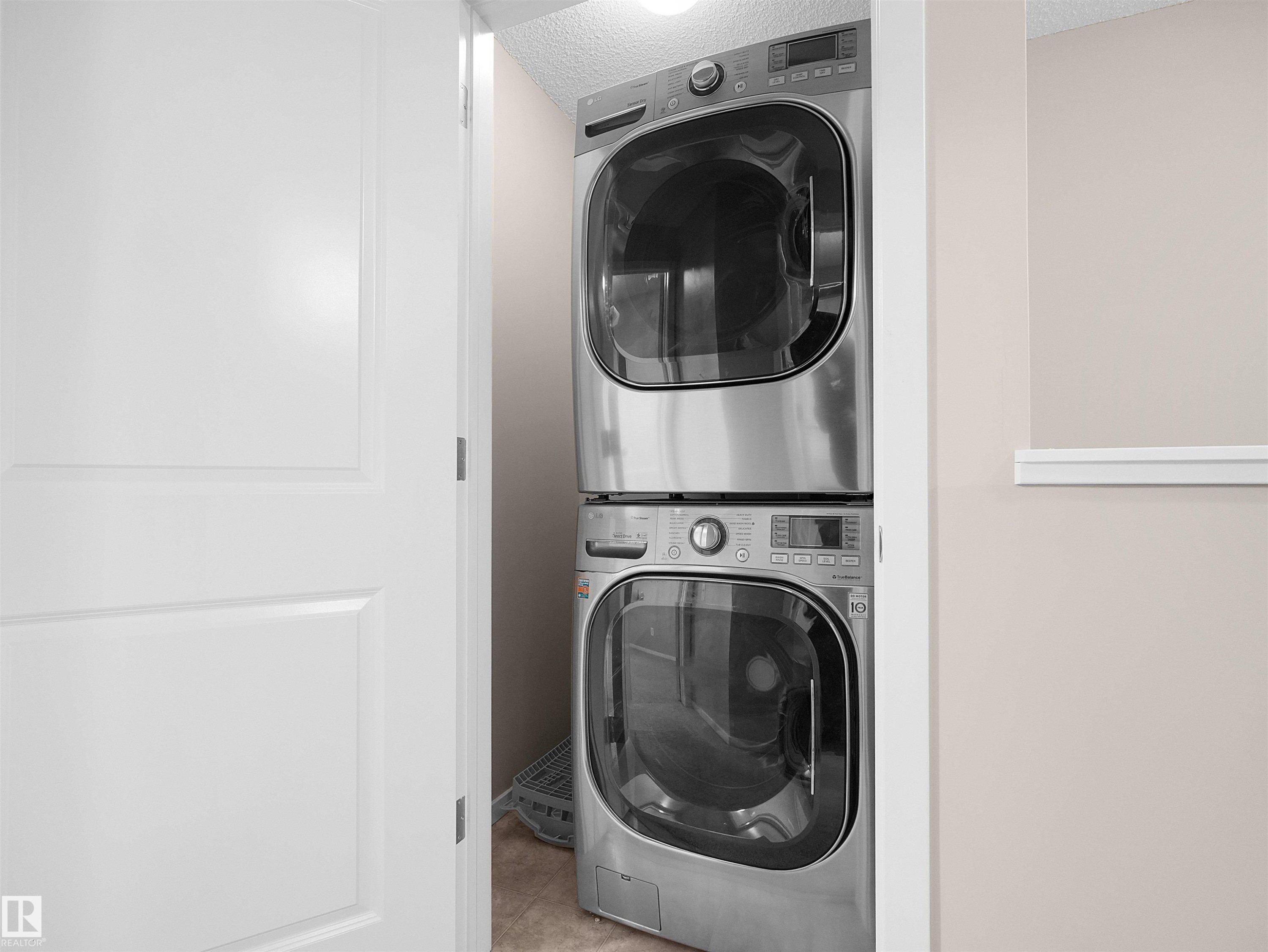 Stacked stainless steel washer and dryer - #162 603 Watt Bv Sw, Edmonton, AB