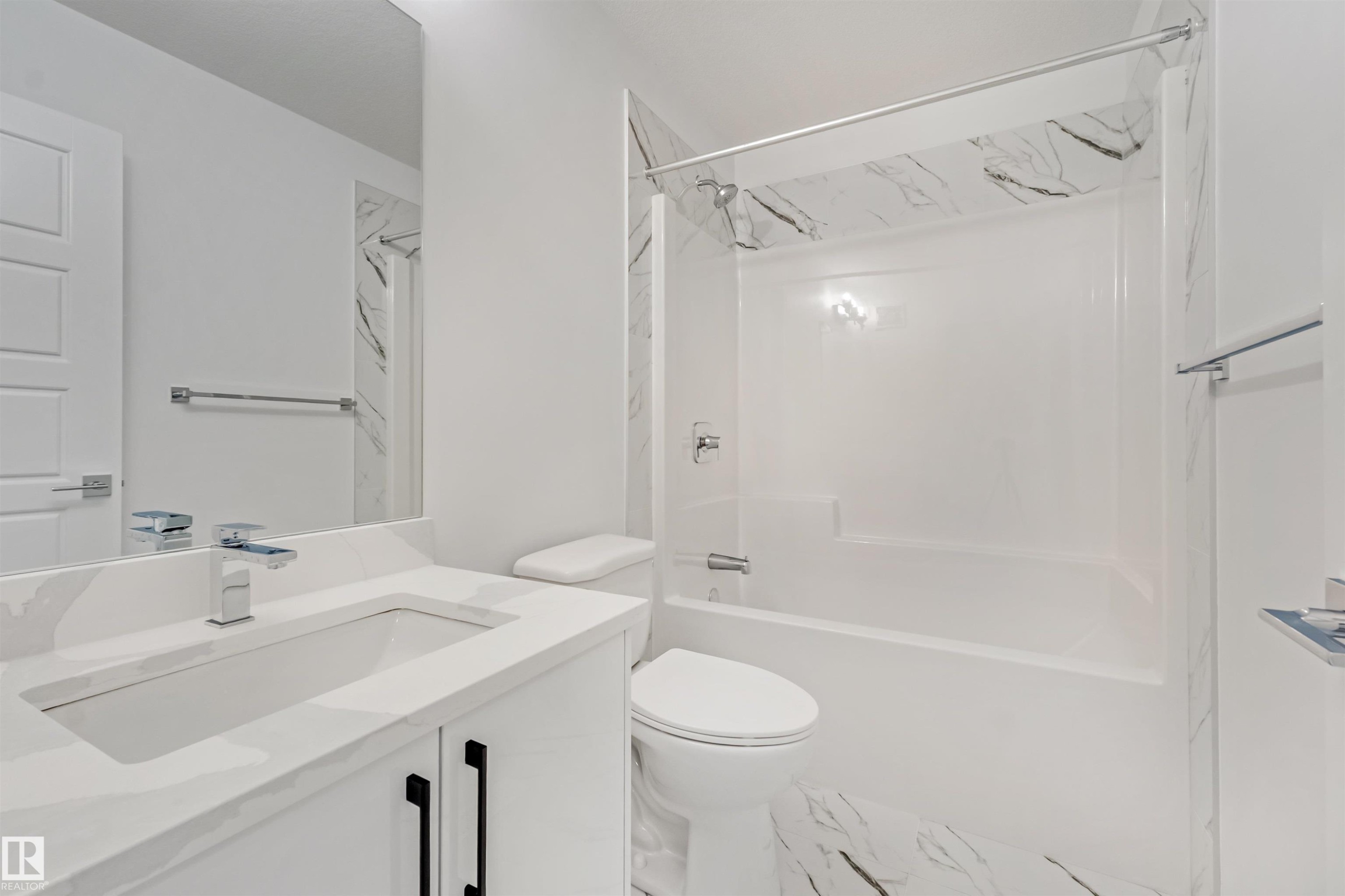 White vanity with integrated rectangular sink, chrome faucet, and black hardware - 1515 211 Street Nw, Edmonton, AB
