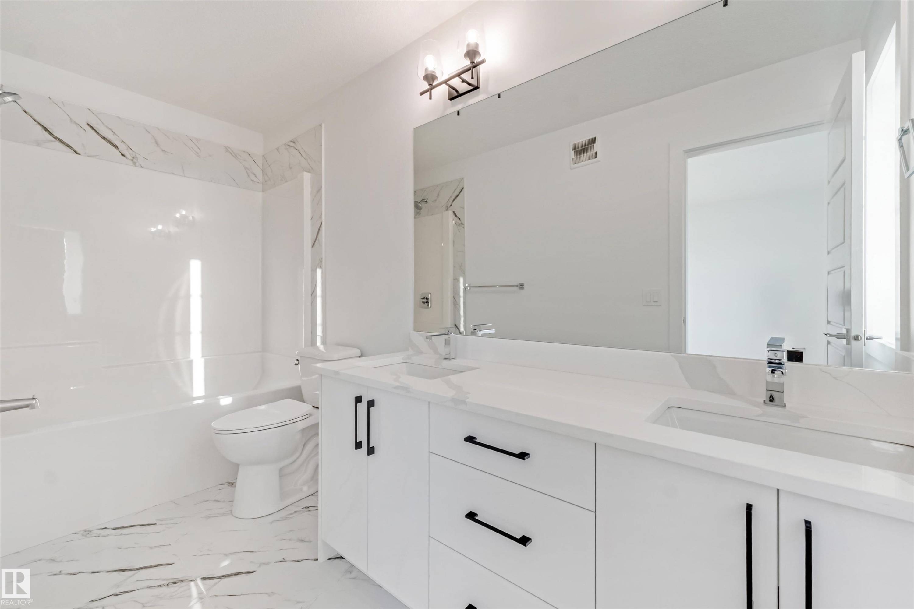 White vanity with dual integrated sinks, chrome faucets, and matte black hardware - 1515 211 Street Nw, Edmonton, AB
