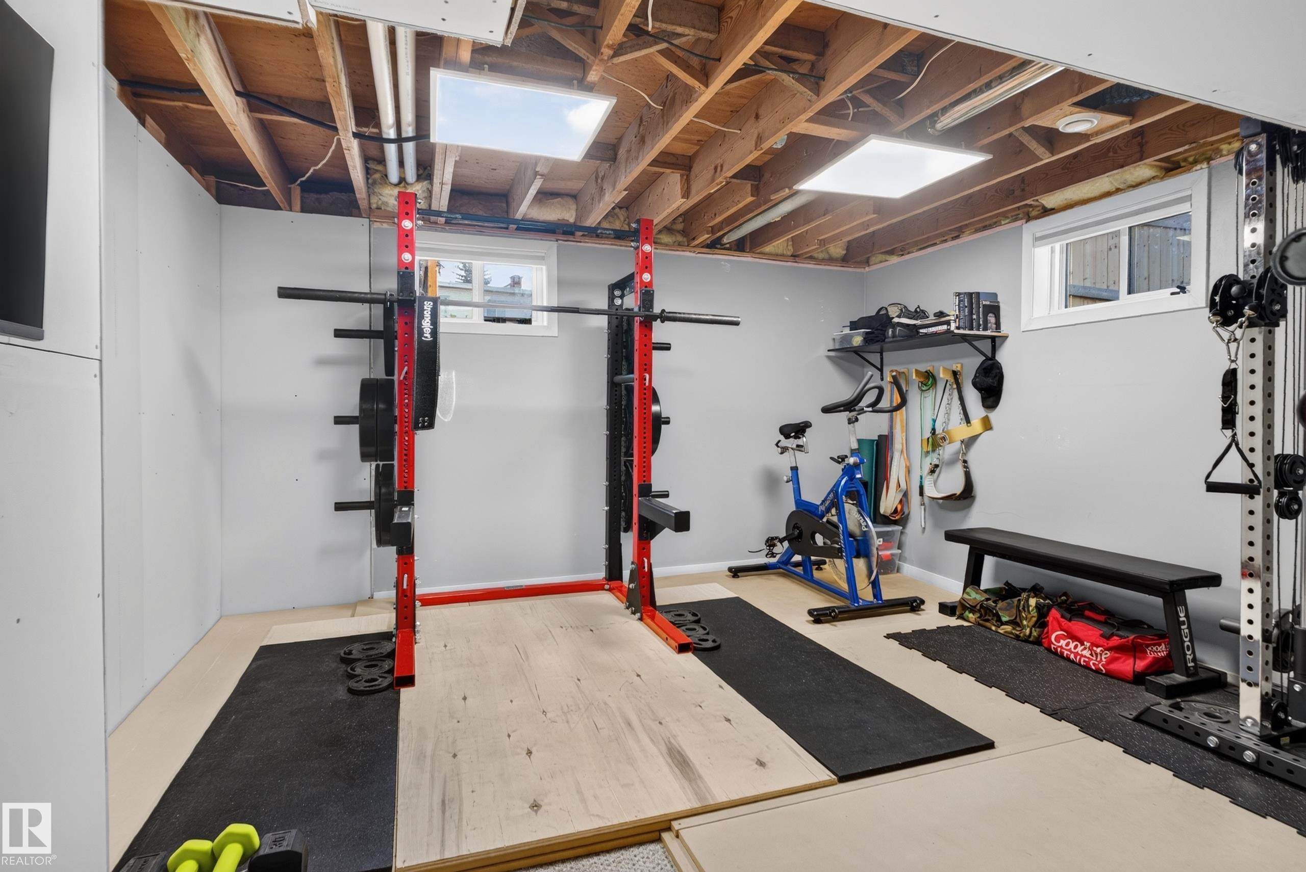 Finished room featuring light gray walls, exposed ceiling joists, and recessed lighting - 14611 109 Avenue Nw, Edmonton, AB