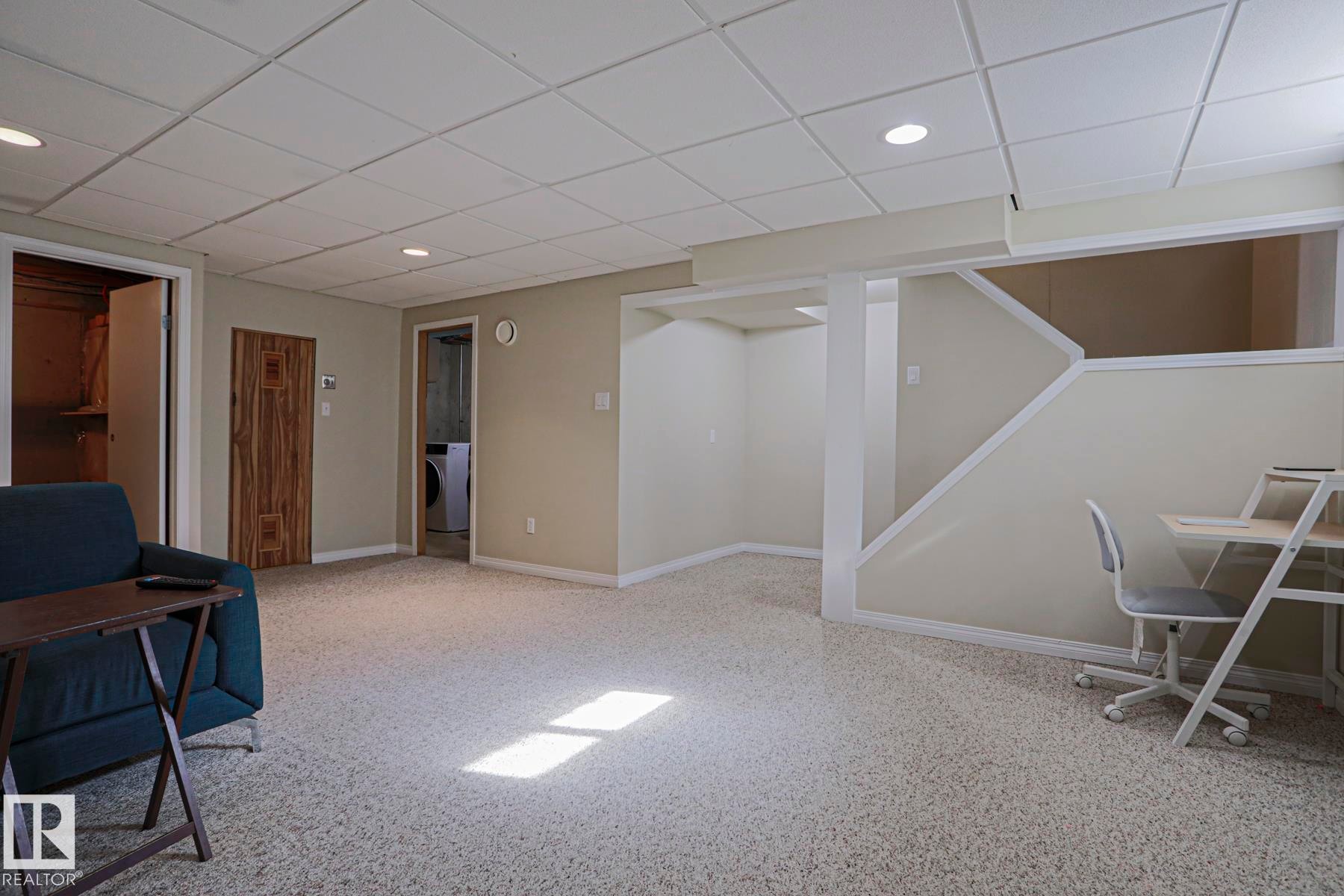 Finished ceiling with recessed lighting, light-toned walls, and carpet flooring - 319 Telford Court, Leduc, AB
