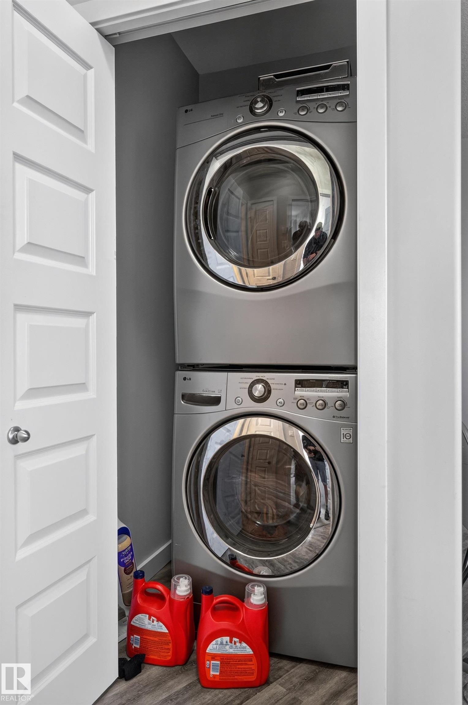 Stackable washer and dryer unit within a dedicated utility closet - #411 304 Ambleside Link Li Sw, Edmonton, AB