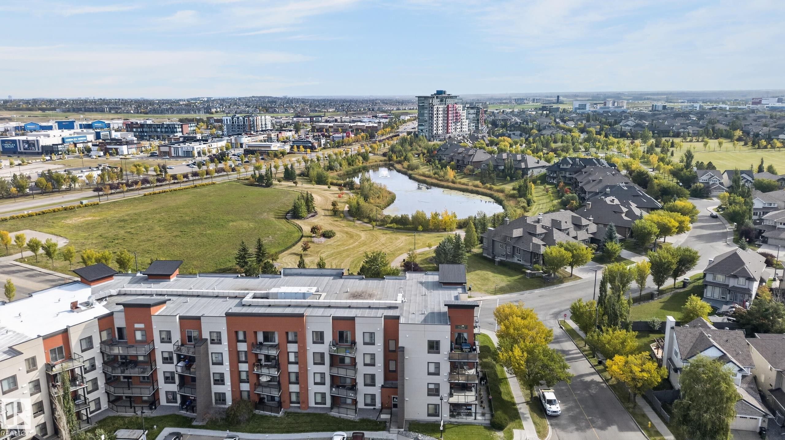Modern multi-story building featuring multiple balconies and a flat roofline - #411 304 Ambleside Link Li Sw, Edmonton, AB