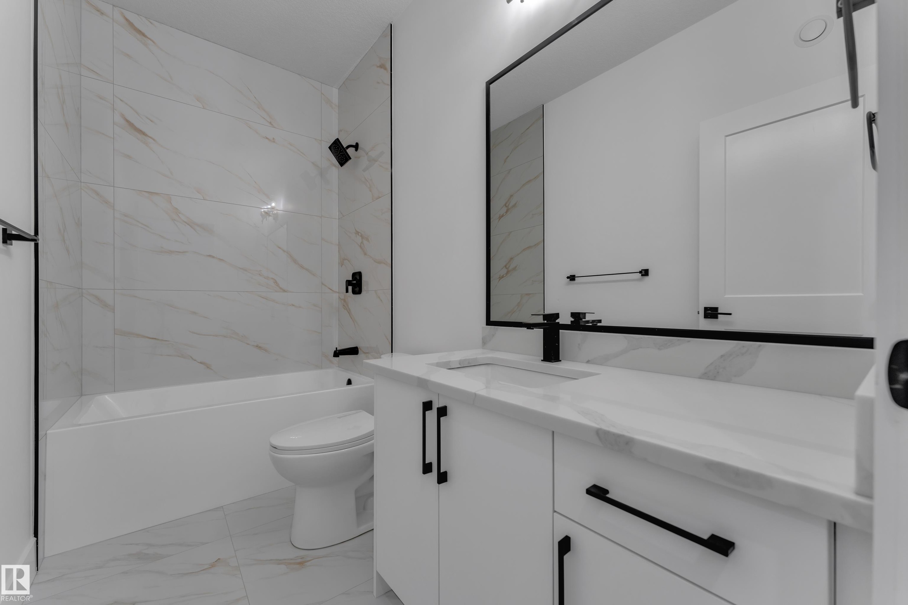 White tiled shower with matte black fixtures - 4212 63 Street, Beaumont, AB