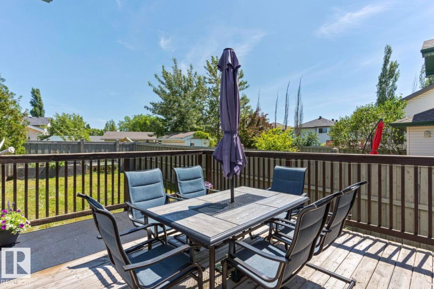 Spacious wood deck featuring a railing and ample room for outdoor dining - 1007 Macewan Close Sw, Edmonton, AB - Outdoor With Deck Patio Veranda With Exterior