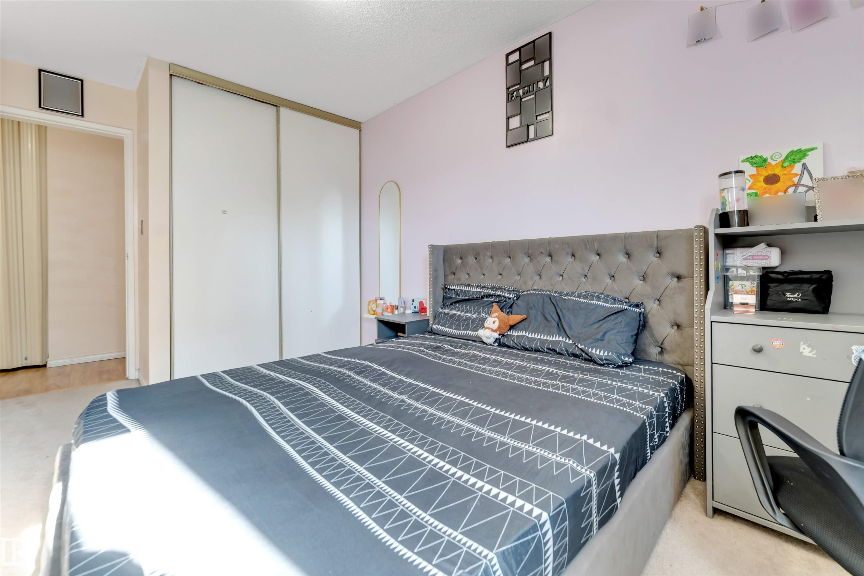 Sliding closet doors, light-colored wall paint, and overhead lighting - #101 49 Akins Dr, St. Albert, AB