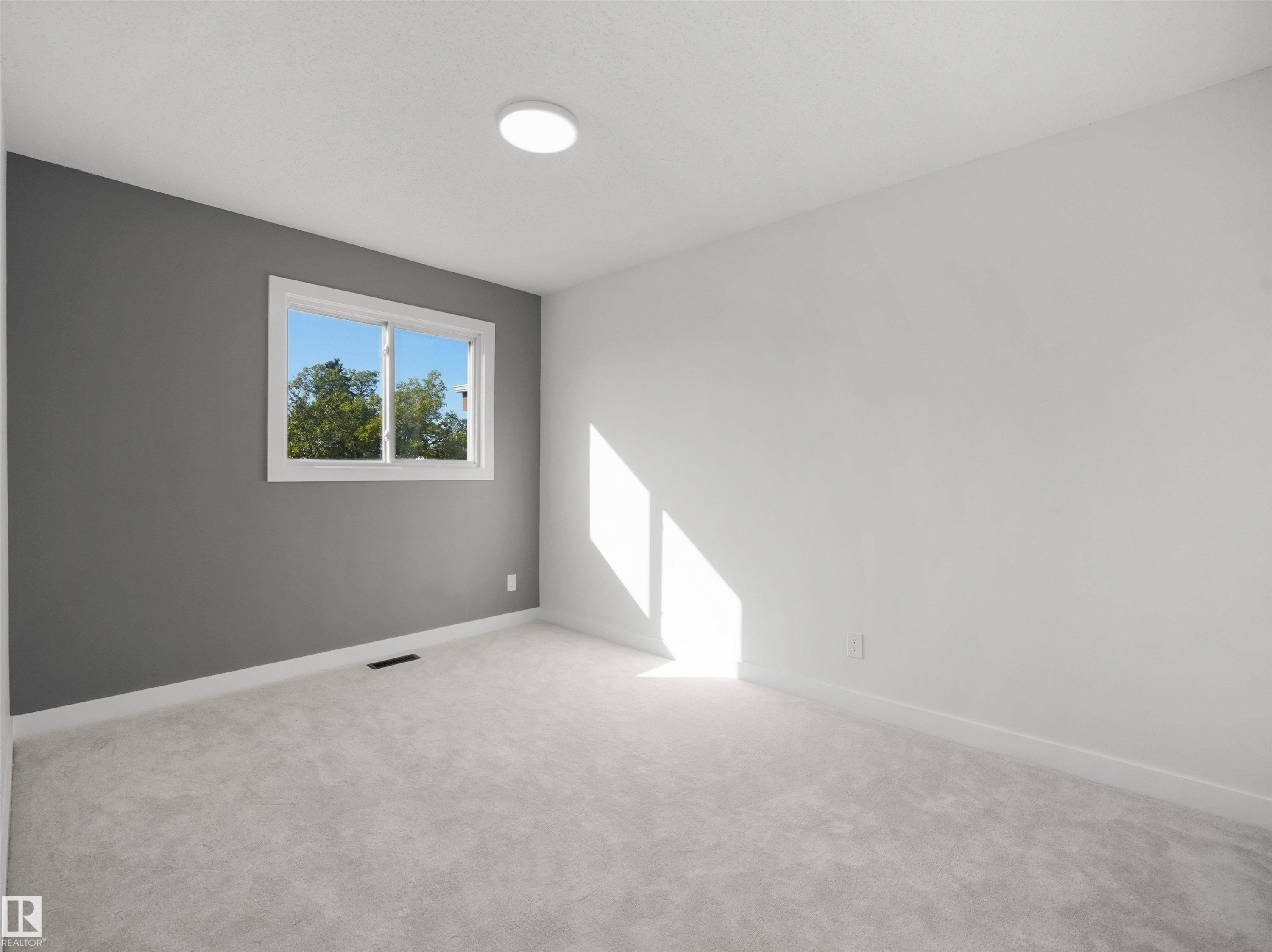 Window with white trim, light-colored carpeting, recessed ceiling light, and a two-toned wall finish - 12C Twin Terrace Nw, Edmonton, AB