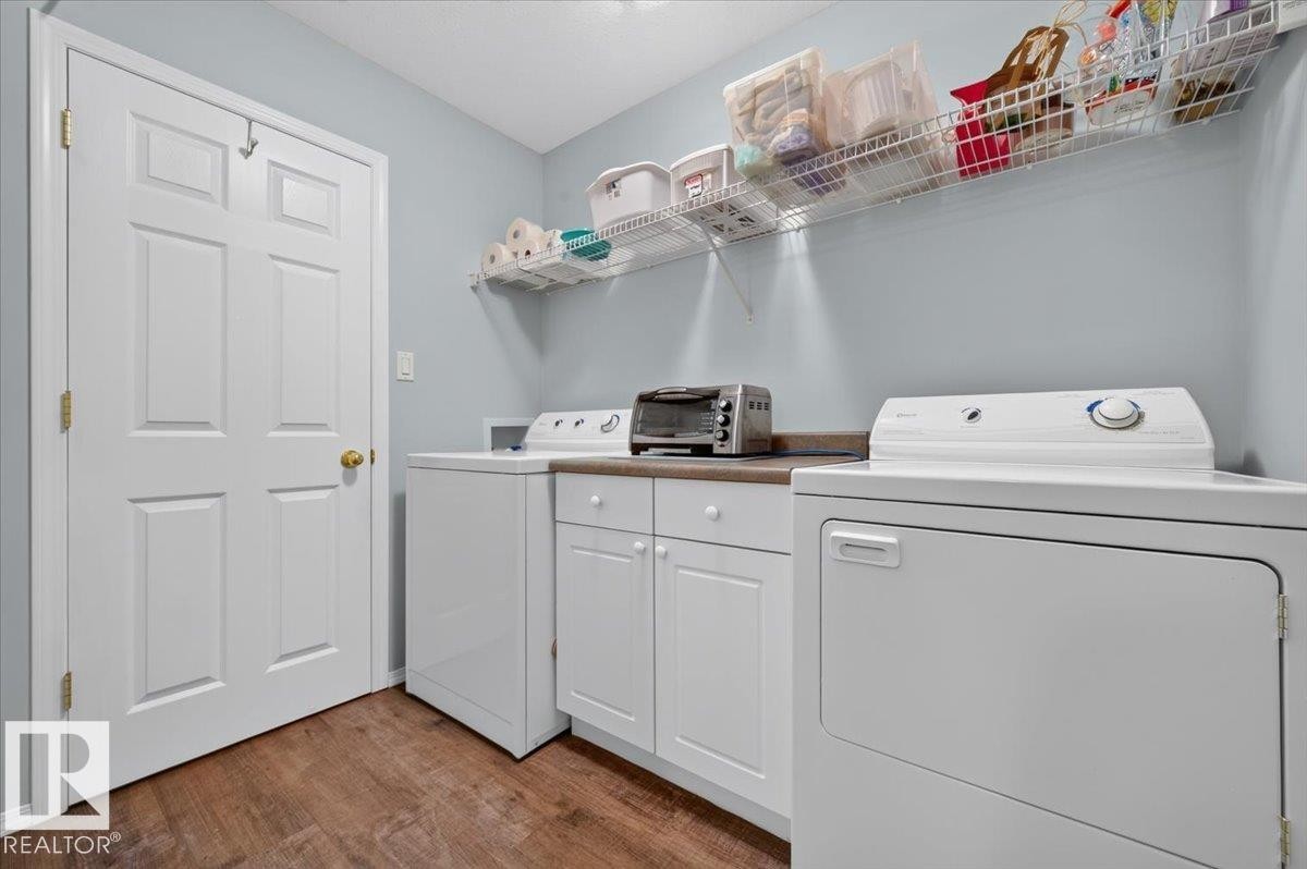 Wood-finish flooring with light blue walls - #125 4610 50 Ave, Stony Plain, AB