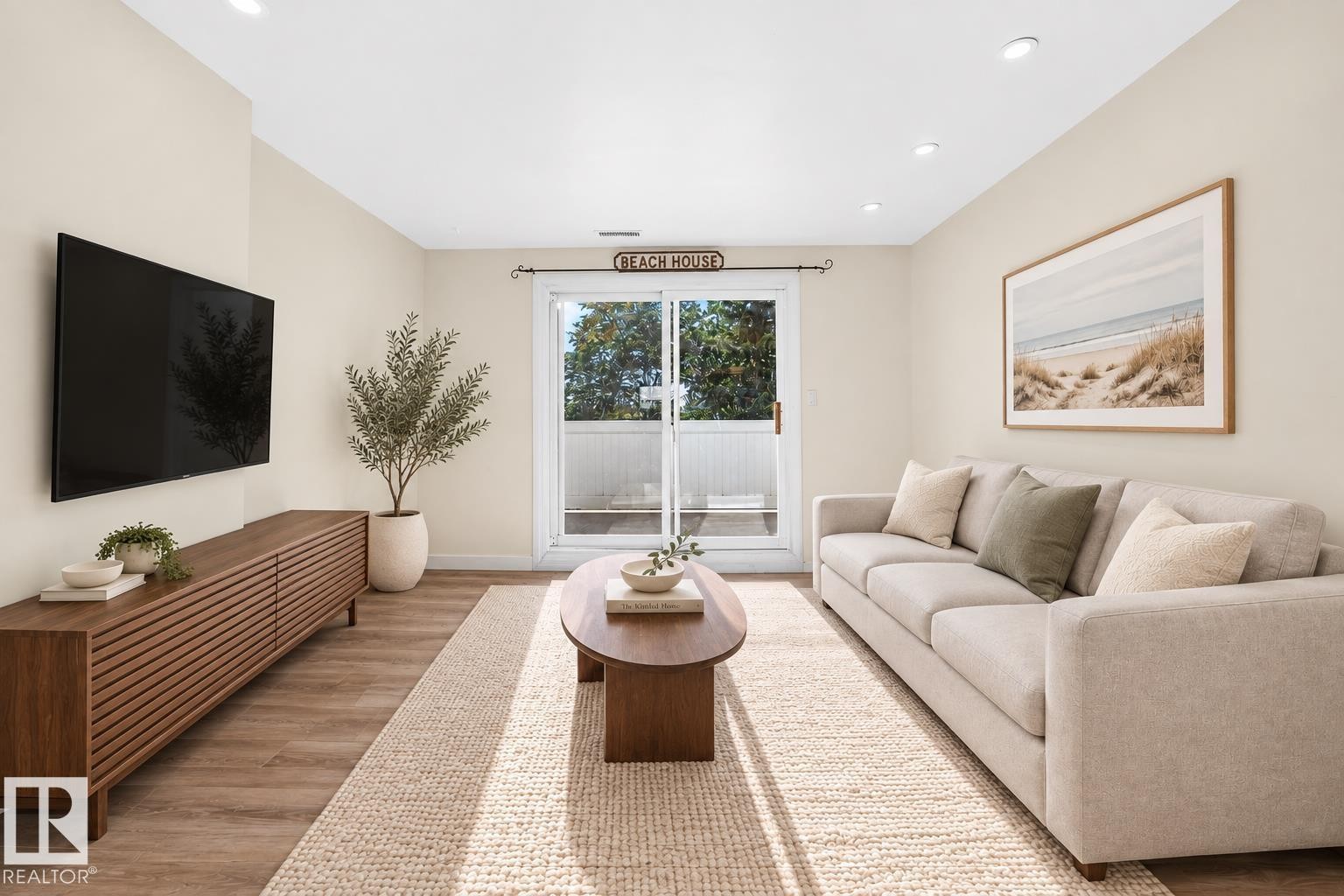Recessed ceiling lighting, wood-finish flooring, sliding glass door, and neutral wall tones - 161 Lancaster Terrace Nw, Edmonton, AB