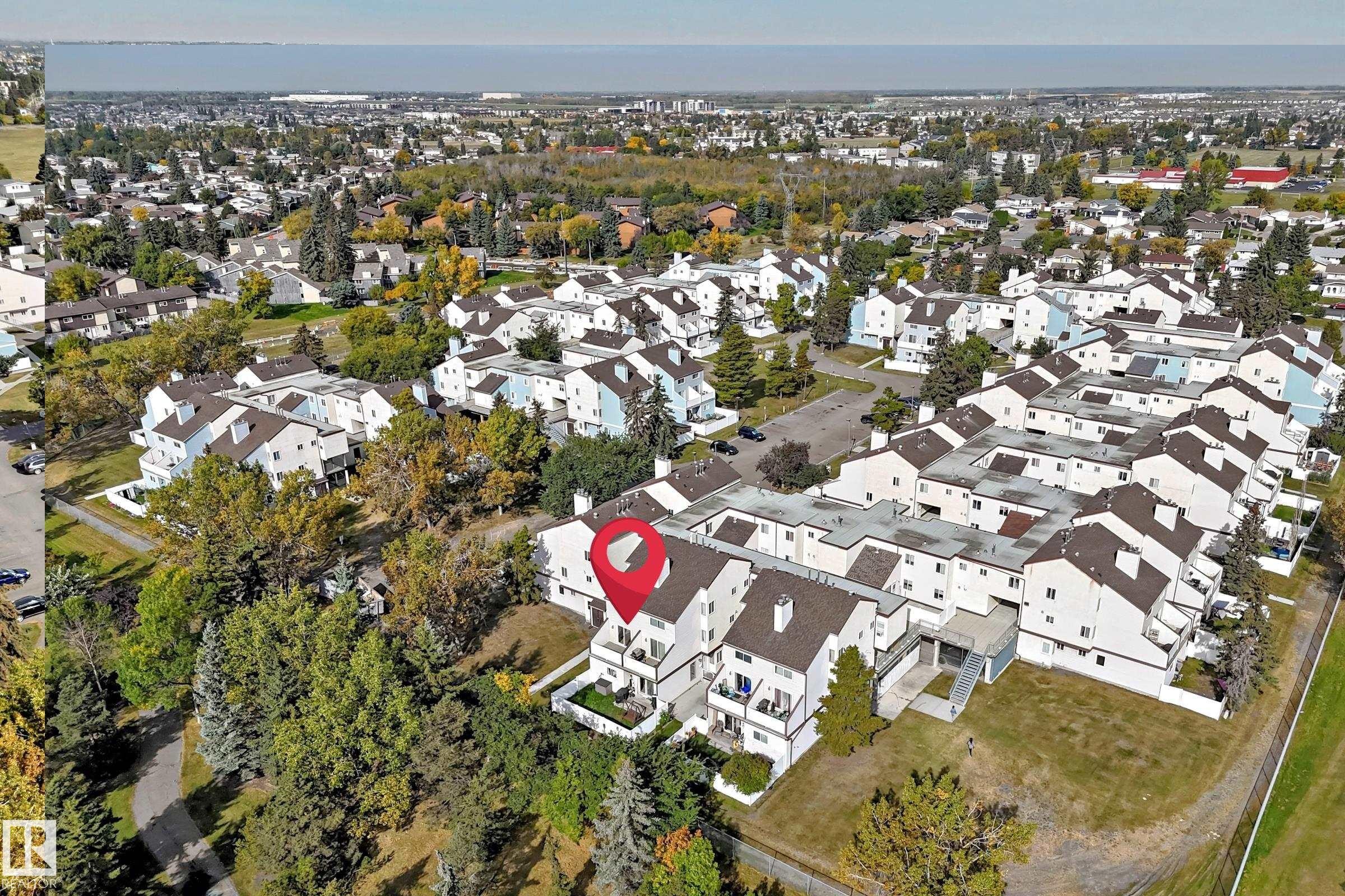 Aerial perspective of a multi-unit property within a residential community - 161 Lancaster Terrace Nw, Edmonton, AB