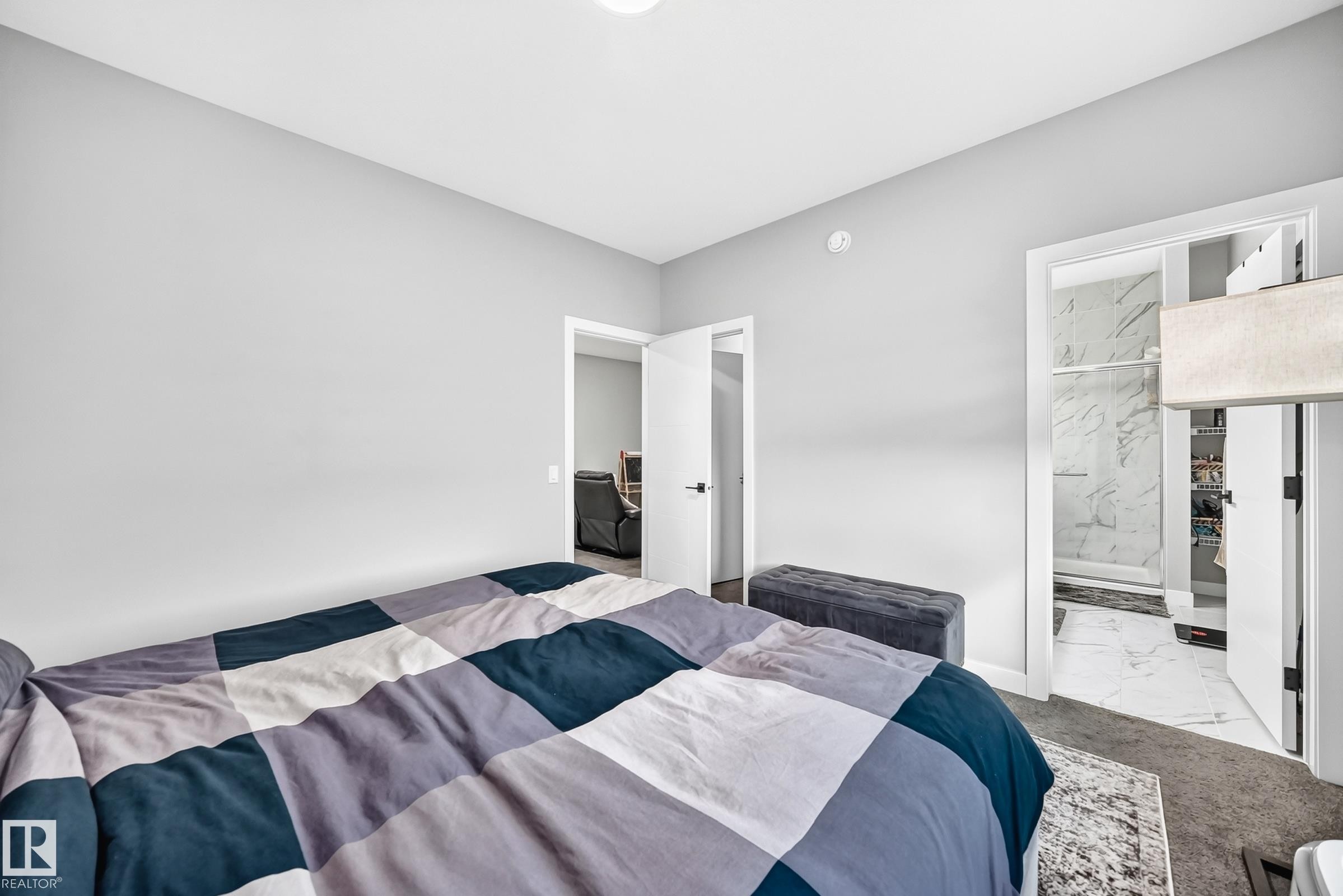 Recessed lighting, light gray wall finishes, and dark carpeting - 2415 194 Street Nw, Edmonton, AB