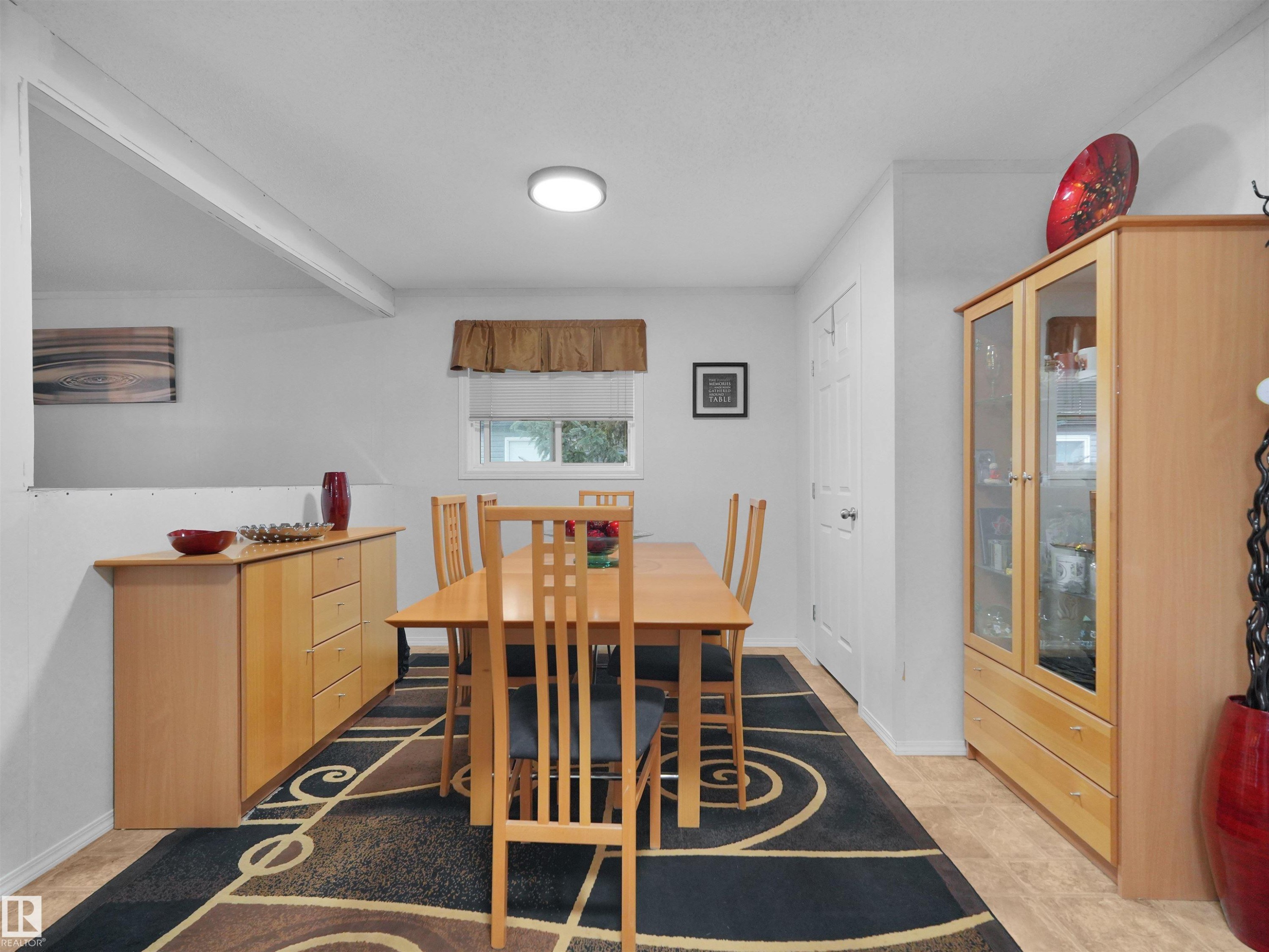 Recessed ceiling light fixture, neutral wall color, built-in window, and light wood-finish flooring - 52 Evergreen Park Northwest, Edmonton, AB