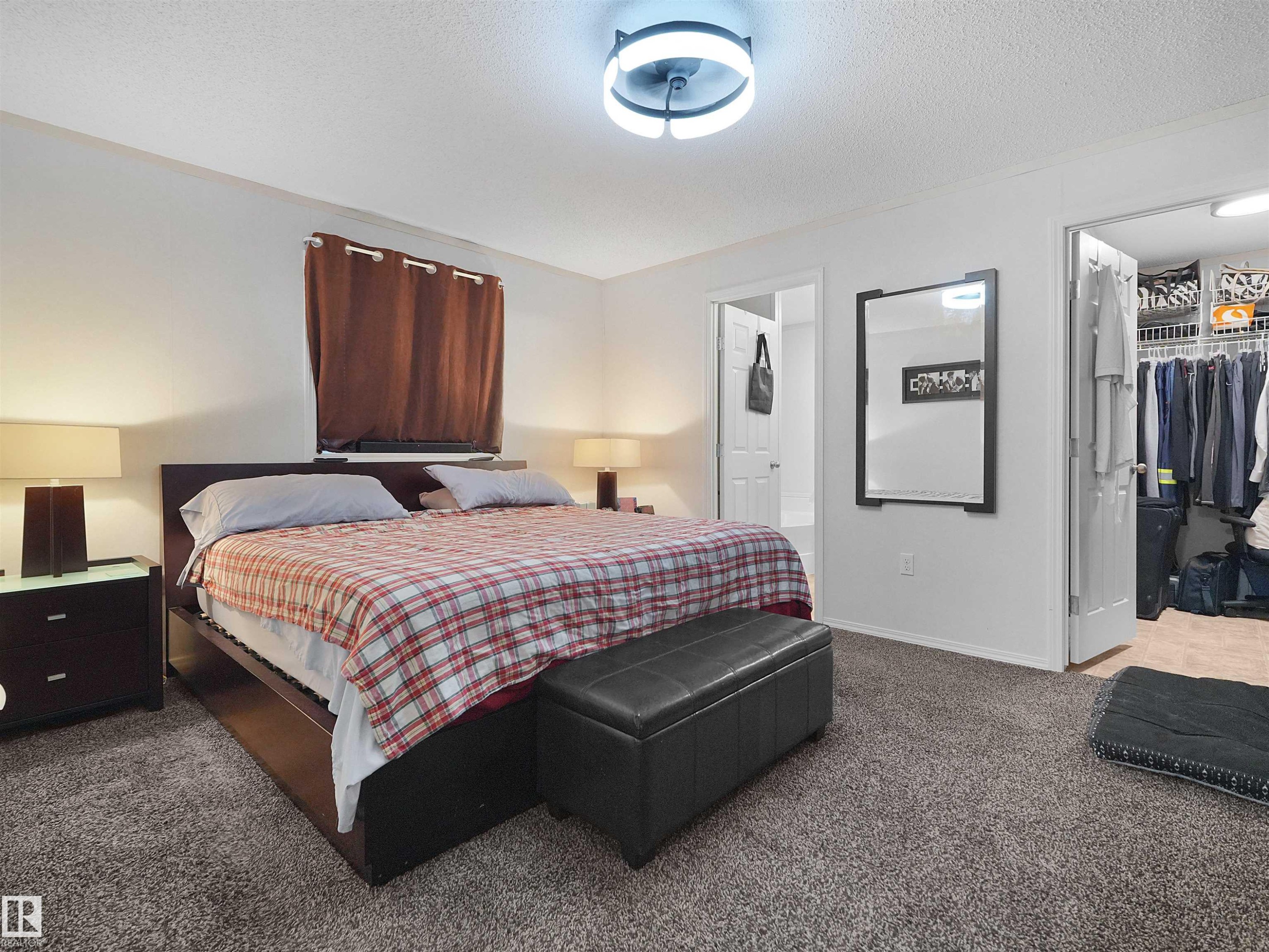 Plush carpeting, recessed ceiling lighting, and a built-in closet organization system - 52 Evergreen Park Northwest, Edmonton, AB