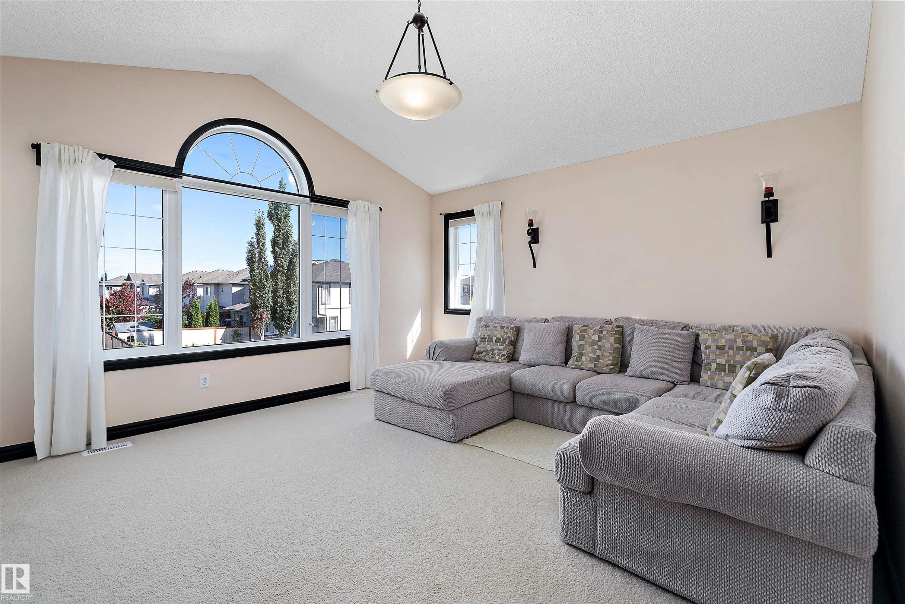 Vaulted ceiling, arched transom window, large picture windows, wall sconces, ceiling-mounted light fixture - 11515 16 Avenue Sw, Edmonton, AB