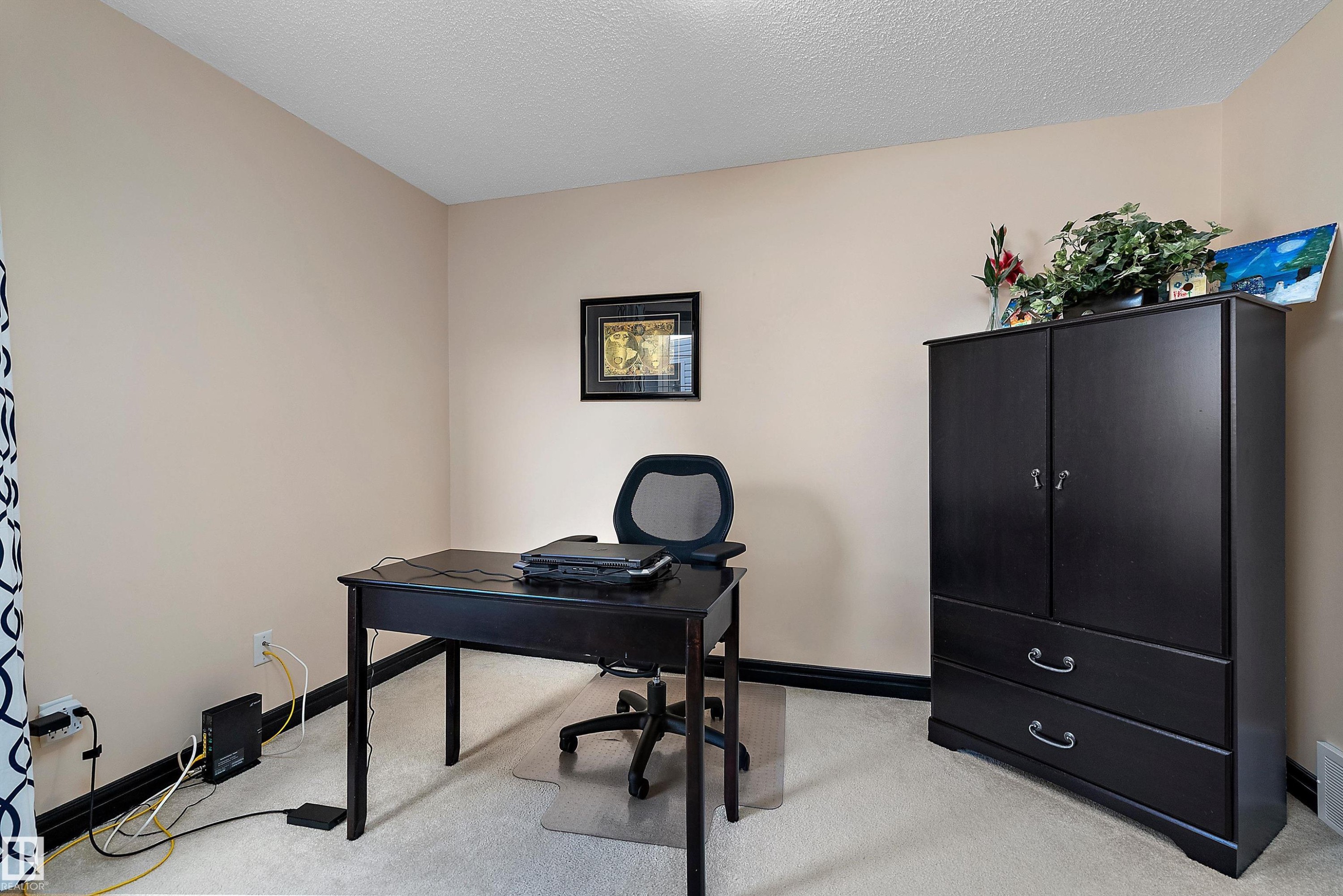 Carpeted flooring, neutral wall color, and dark trim - 11515 16 Avenue Sw, Edmonton, AB