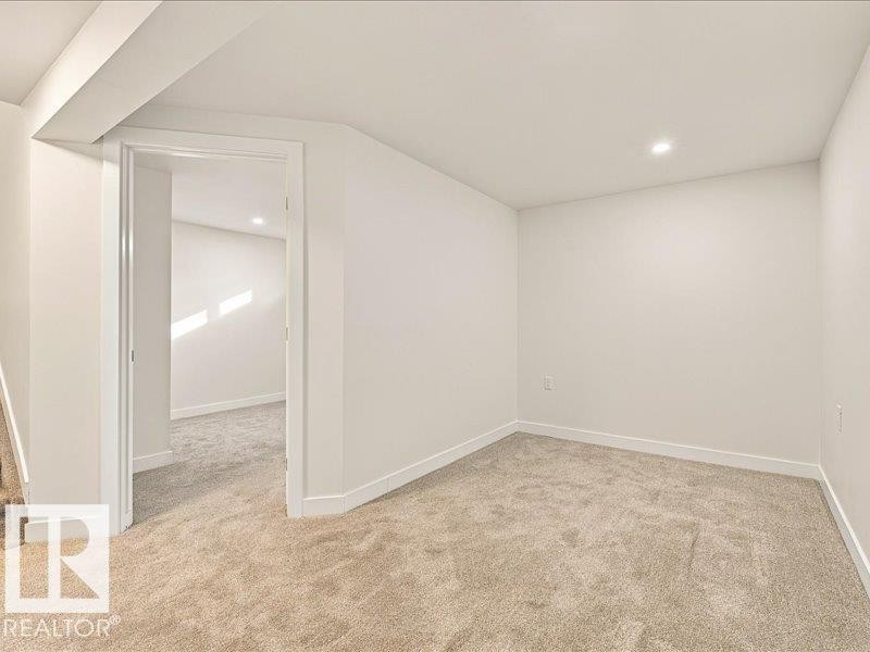 Recessed ceiling lighting, neutral carpet, white walls, and white trim - 18325 66 Avenue Nw, Edmonton, AB