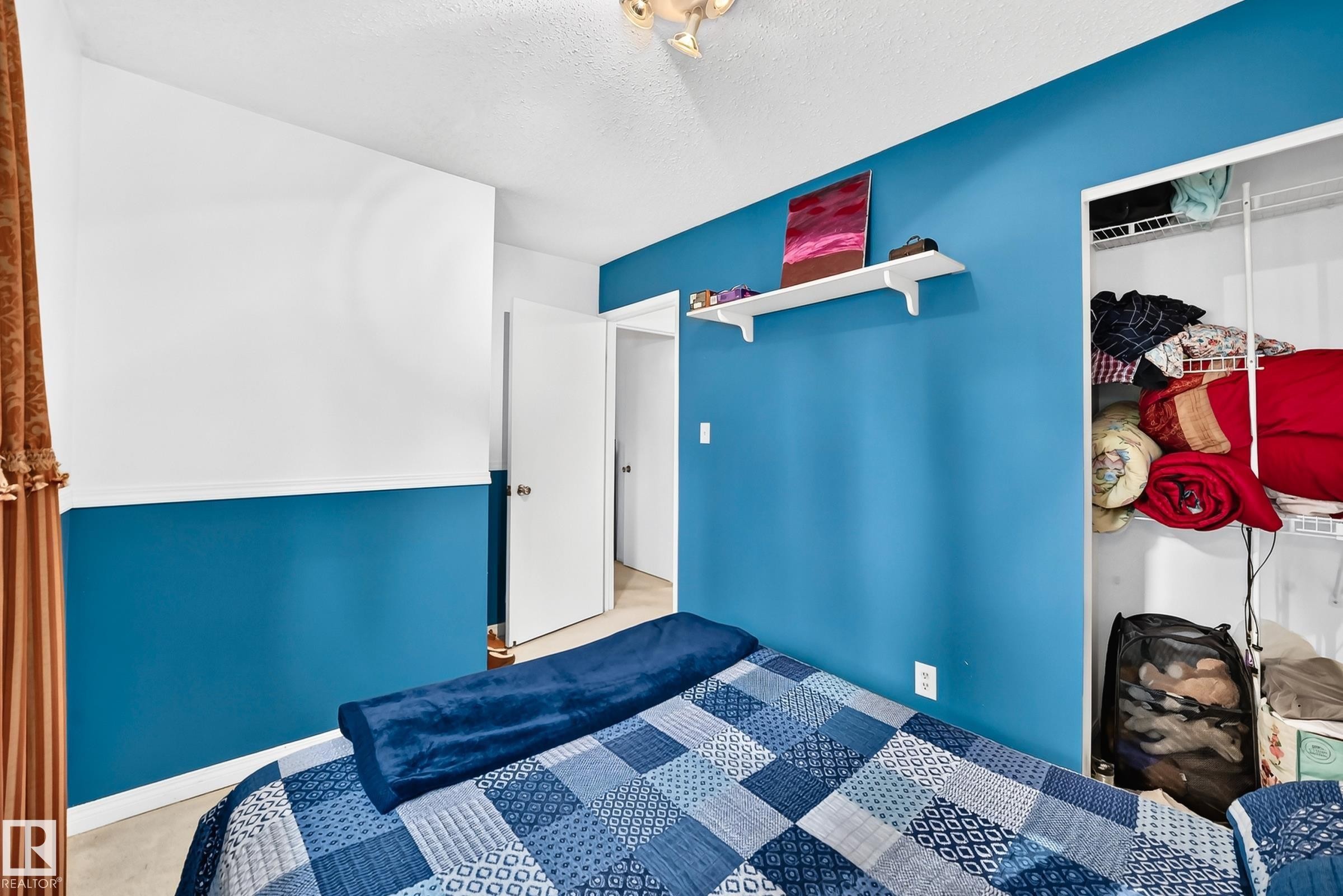 Built-in open shelving within closet - 11007 173A Avenue Nw, Edmonton, AB