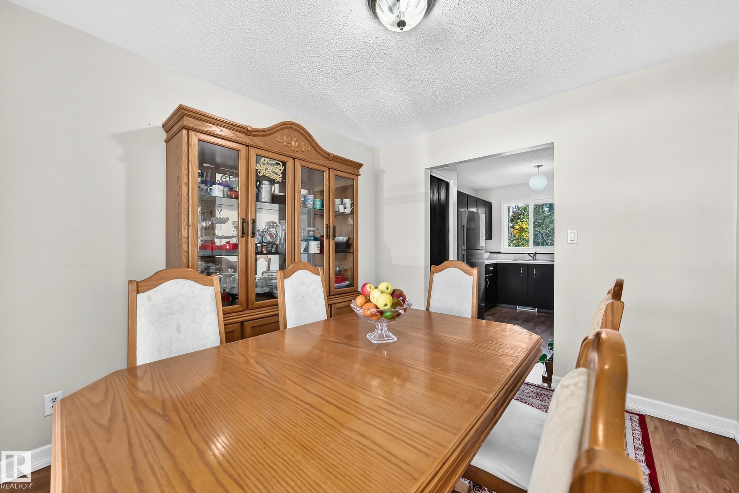Recessed wall opening, wood-finish flooring, and a ceiling-mounted light fixture - 11007 173A Avenue Nw, Edmonton, AB