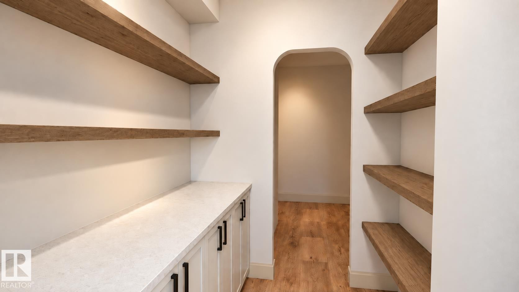 Built-in cabinetry with dark hardware, a light-toned countertop, and wood-finish open shelving - 30 Brickyard View, Stony Plain, AB