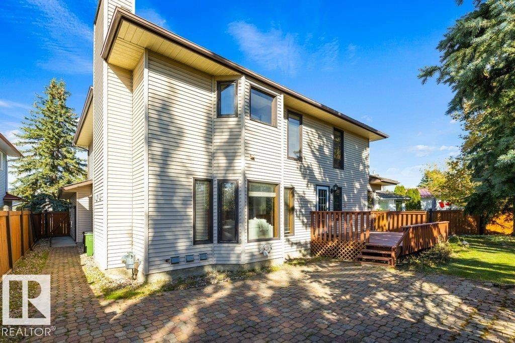 Multi-level siding exterior with prominent chimney - 507 Burton Close Nw, Edmonton, AB