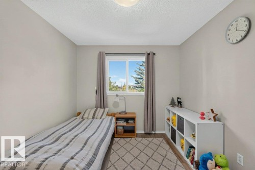 Neutral wall paint and wood-finish flooring - #41 287 Macewan Rd Sw, Edmonton, AB 